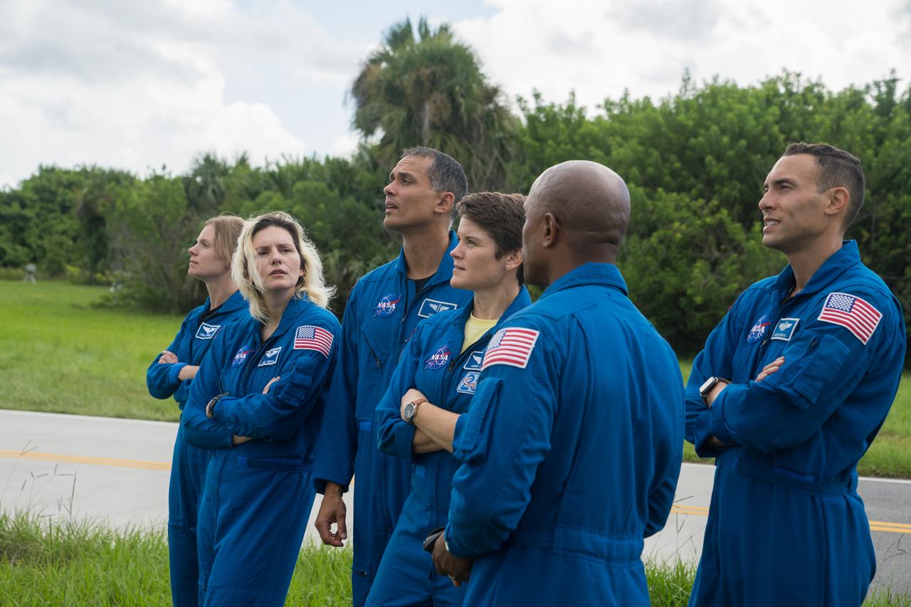 NASA astronauts and astronaut candidates view NASA’s Artemis I Space Launch System and Orion spacecraft atop the mobile launcher on the pad at Launch Complex 39B at the agency’s Kennedy Space Center in Florida on Sept. 2, 2022. The astronauts are, from left to right: Zena Cardman, NASA astronaut; Deniz Burnham and Anil Menon, NASA astronaut candidates; Anne McClain, NASA astronaut; Marcos Berrios, NASA astronaut candidate; and Victor Glover, NASA astronaut. The first in a series of increasingly complex missions, Artemis I will provide a foundation for human deep space exploration and demonstrate our commitment and capability to extend human presence to the Moon and beyond. The primary goal of Artemis I is to thoroughly test the integrated systems before crewed missions by operating the spacecraft in a deep space environment, testing Orion’s heat shield, and recovering the crew module after reentry, descent, and splashdown. In later missions, NASA will land the first woman and the first person of color on the surface of the Moon, paving the way for a long-term lunar presence and serving as a steppingstone on the way to Mars.