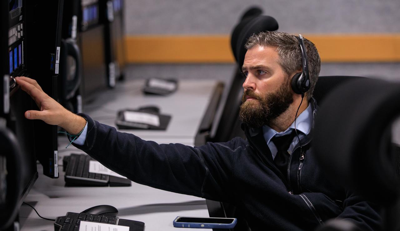 A member of the Artemis I launch team monitors his console inside Firing Room 1 of the Rocco A. Petrone Launch Control Center at NASA’s Kennedy Space Center in Florida during launch countdown Sept. 3, 2022. Launch of the agency’s Space Launch System and Orion spacecraft from Kennedy’s Launch Complex 39B was waved off due to an issue during tanking. The first in a series of increasingly complex missions, Artemis I will provide a foundation for human deep space exploration and demonstrate our commitment and capability to extend human presence to the Moon and beyond. The primary goal of Artemis I is to thoroughly test the integrated systems before crewed missions by operating the spacecraft in a deep space environment, testing Orion’s heat shield, and recovering the crew module after reentry, descent, and splashdown.