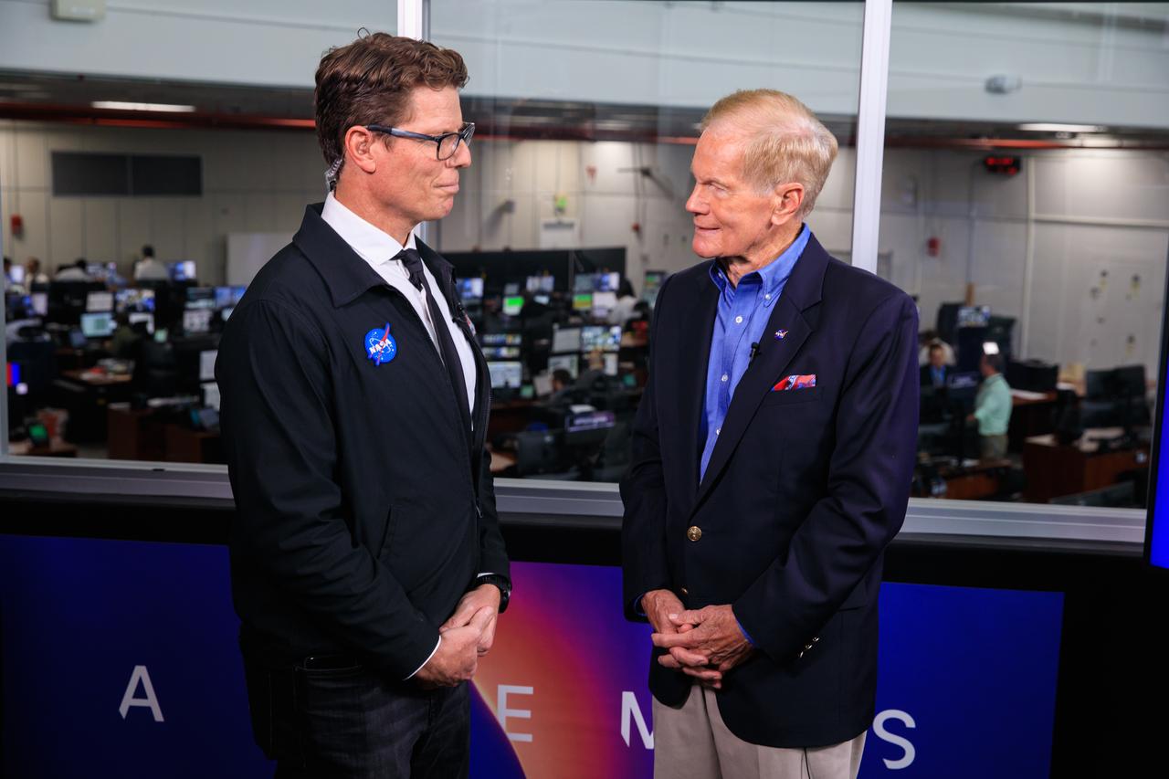 NASA commentator Derrol Nail, at left, talks with NASA Administrator Bill Nelson during the Artemis I launch countdown inside Firing Room 1 of the Rocco A. Petrone Launch Control Center at NASA’s Kennedy Space Center in Florida on Sept. 3, 2022. Launch of the agency’s Space Launch System and Orion spacecraft from Kennedy’s Launch Complex 39B was waved off due to an issue during tanking. The first in a series of increasingly complex missions, Artemis I will provide a foundation for human deep space exploration and demonstrate our commitment and capability to extend human presence to the Moon and beyond. The primary goal of Artemis I is to thoroughly test the integrated systems before crewed missions by operating the spacecraft in a deep space environment, testing Orion’s heat shield, and recovering the crew module after reentry, descent, and splashdown. 
