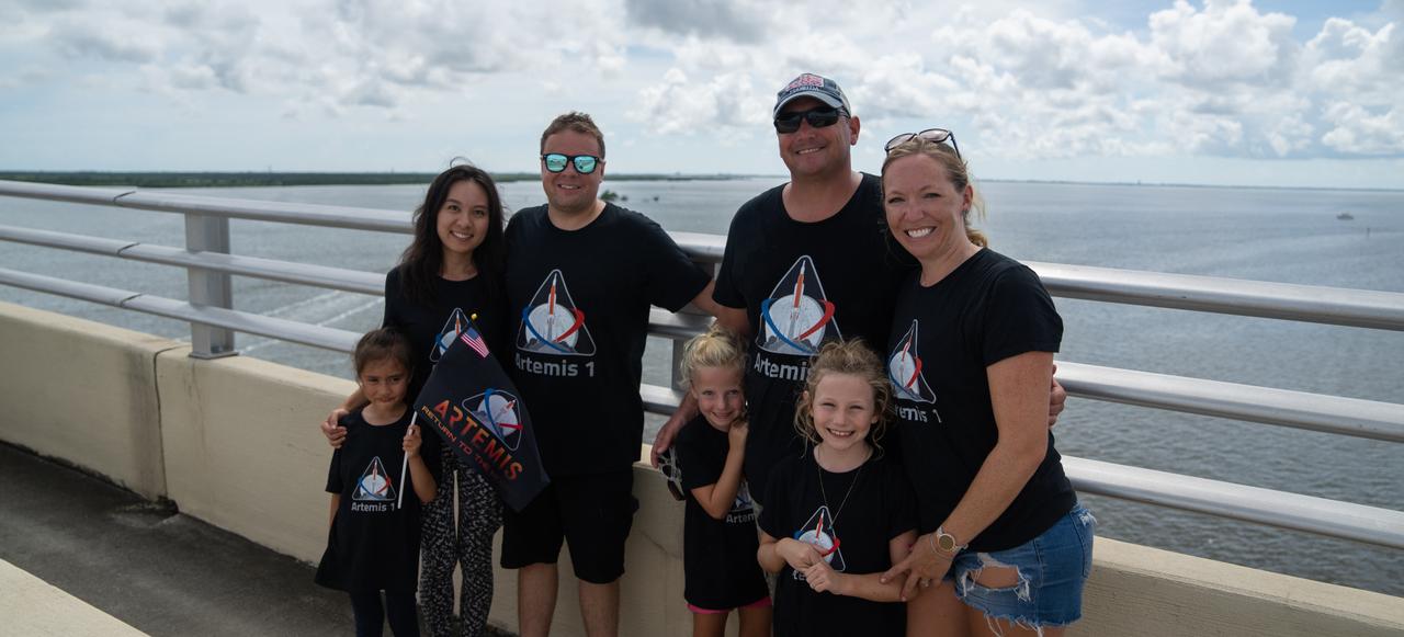 A family wearing matching Artemis shirts are on the Max Brewer Bridge in Titusville, Florida, to witness the launch of NASA’s Artemis I mission on Sept. 3, 2022. The launch was waived off for the day. The first in a series of increasingly complex missions, Artemis I will provide a foundation for human deep space exploration and demonstrate our commitment and capability to extend human presence to the Moon and beyond. The primary goal of Artemis I is to thoroughly test the integrated systems before crewed missions by operating the spacecraft in a deep space environment, testing Orion’s heat shield, and recovering the crew module after reentry, descent, and splashdown. 