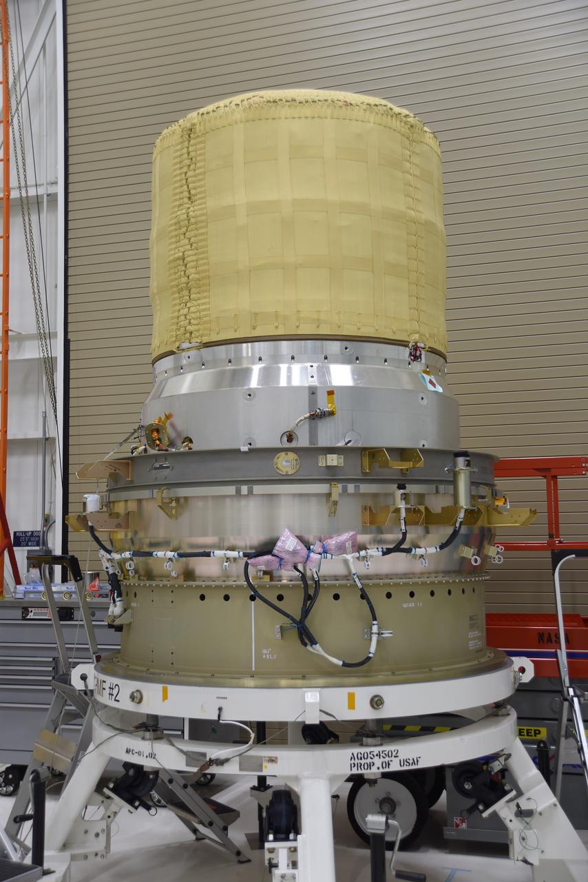 The re-entry vehicle for the Low-Earth Orbit Flight Test of an Inflatable Decelerator (LOFTID) is now mated to the re-entry vehicle payload adapter interface ring and secured on a work stand as part of launch preparations inside Building 836 at Vandenberg Space Force Base (VSFB) in California on Sept. 7, 2022. LOFTID is the secondary payload on NASA and the National Oceanic and Atmospheric Administration’s (NOAA) Joint Polar Satellite System-2 (JPSS-2) satellite mission. JPSS-2 is the third satellite in the Joint Polar Satellite System series. It is scheduled to lift off from VSFB on Nov. 1 from Space Launch Complex-3. JPSS-2, which will be renamed NOAA-21 after reaching orbit, will join a constellation of JPSS satellites that orbit from the North to the South pole, circling Earth 14 times a day and providing a full view of the entire globe twice daily. LOFTID will demonstrate inflatable heat shield technology that could enable a variety of proposed NASA missions to destinations such as Mars, Venus, and Titan, as well as returning heavier payloads from low-Earth orbit. 