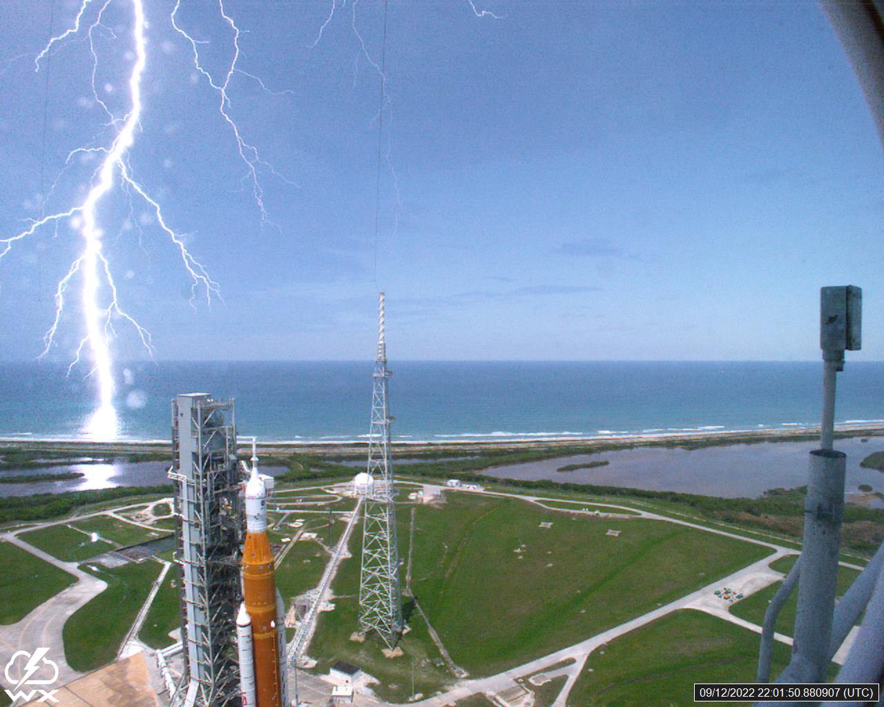 A lightning strike was recorded at Launch Complex 39B at NASA’s Kennedy Space Center in Florida on Sept. 12, 2022. NASA’s Space Launch System (SLS) and Orion spacecraft atop the mobile launcher are in view on the launch pad in preparation for the Artemis I mission. The lightning strike was recorded by cameras stationed at the pad and mobile launcher using a special filter called a “clear day frame,” which provides an overlay of the raw frame on a reference image. Artemis I will be the first integrated test of the SLS and Orion spacecraft. In later missions, NASA will land the first woman and the first woman of color on the surface of the Moon, paving the way for a long-term lunar presence and serving as a steppingstone on the way to Mars. 