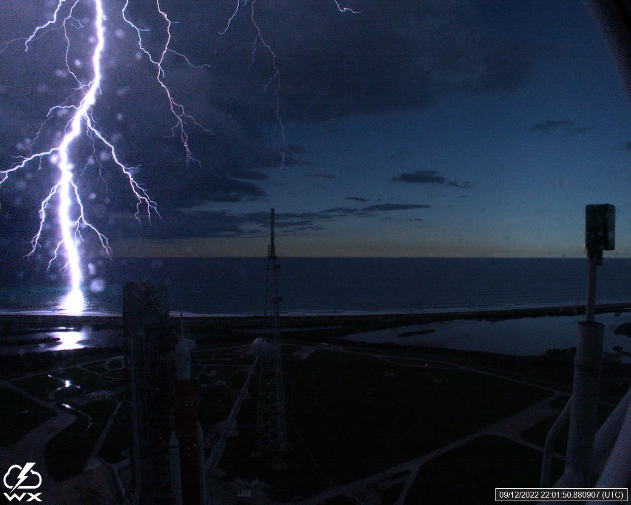 A lightning strike was recorded at Launch Complex 39B at NASA’s Kennedy Space Center in Florida on Sept. 12, 2022. NASA’s Space Launch System (SLS) and Orion spacecraft atop the mobile launcher are on the launch pad in preparation for the Artemis I mission. The lightning strike was recorded by cameras stationed at the pad and mobile launcher using a special filter called a “clear day frame,” which provides an overlay of the raw frame on a reference image. Artemis I will be the first integrated test of the SLS and Orion spacecraft. In later missions, NASA will land the first woman and the first woman of color on the surface of the Moon, paving the way for a long-term lunar presence and serving as a steppingstone on the way to Mars. 