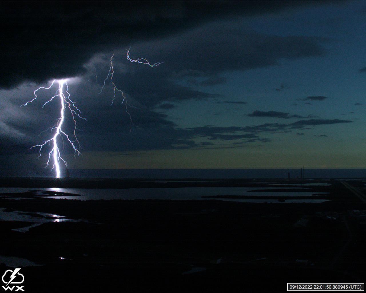 A lightning strike was recorded at Launch Complex 39B at NASA’s Kennedy Space Center in Florida on Sept. 12, 2022. NASA’s Space Launch System (SLS) and Orion spacecraft atop the mobile launcher are on the launch pad in preparation for the Artemis I mission. The lightning strike was recorded by cameras stationed at the pad and mobile launcher using a special filter called a “clear day frame,” which provides an overlay of the raw frame on a reference image. Artemis I will be the first integrated test of the SLS and Orion spacecraft. In later missions, NASA will land the first woman and the first woman of color on the surface of the Moon, paving the way for a long-term lunar presence and serving as a steppingstone on the way to Mars. 