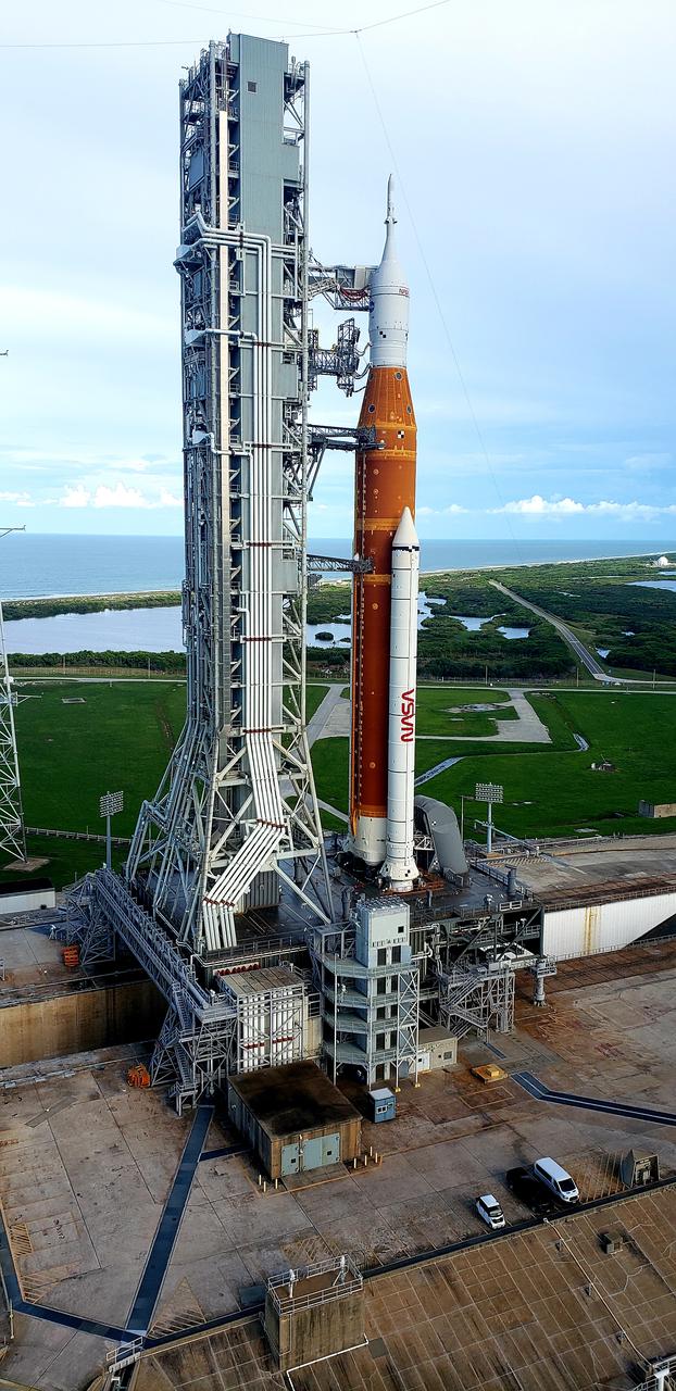 A close-up view of the Artemis I Space Launch System (SLS) and Orion spacecraft atop the mobile launcher on Launch Pad 39B at NASA’s Kennedy Space Center in Florida on Sept. 15, 2022. A portion of the umbilical connections are in view, as well as the crew access arm. Artemis I is the first integrated test of the SLS and Orion spacecraft. In future Artemis missions, NASA will land the first woman and the first person of color on the surface of the Moon, paving the way for a long-term lunar presence and serving as a steppingstone on the way to Mars. 