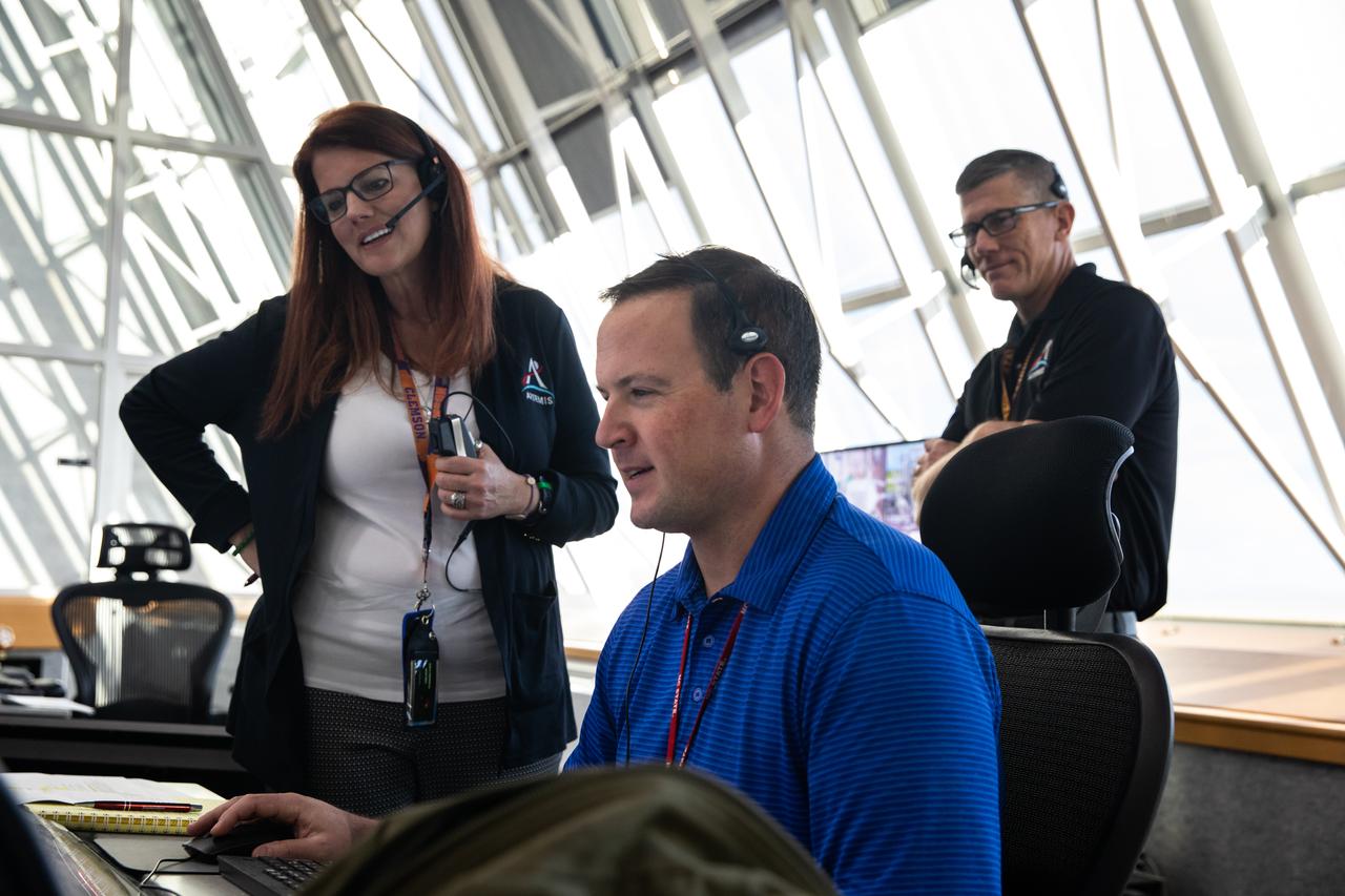 Artemis I Launch Director Charlie Blackwell-Thompson, at left, monitors data inside Firing Room 1 of the Rocco A. Petrone Launch Control Center at NASA’s Kennedy Space Center in Florida during a cryogenic propellant tanking demonstration on Sept. 21, 2022. At right is Wes Mosedale, technical assistant to the launch director. Behind them is Jeremy Graeber, Artemis I assistant launch director. The first in a series of increasingly complex missions, Artemis I will provide a foundation for human deep space exploration and demonstrate our commitment and capability to extend human presence to the Moon and beyond. The primary goal of Artemis I is to thoroughly test the integrated systems before crewed missions by operating the spacecraft in a deep space environment, testing Orion’s heat shield, and recovering the crew module after reentry, descent, and splashdown. 