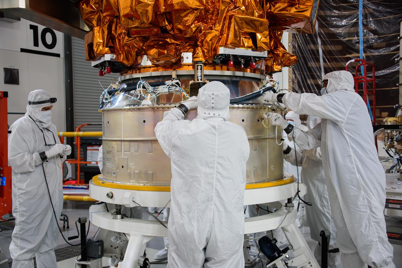 Technicians lower the National Oceanic and Atmospheric Administration’s (NOAA) Joint Polar Satellite System-2 (JPSS-2) onto a payload adapter ring inside the Astrotech Space Operations facility at Vandenberg Space Force Base (VSFB) in California on Oct. 5, 2022. The team stacked JPSS-2 atop the Low-Earth Orbit Flight Test of an Inflatable Decelerator (LOFTID) payload. JPSS-2 is the third satellite in the Joint Polar Satellite System series. It is scheduled to lift off from VSFB on Nov. 1 from Space Launch Complex-3. JPSS-2, which will be renamed NOAA-21 after reaching orbit, will join a constellation of JPSS satellites that orbit from the North to the South pole, circling Earth 14 times a day and providing a full view of the entire globe twice daily. The NOAA/NASA Suomi National Polar-orbiting Partnership (Suomi NPP) satellite, and NOAA-20, previously known as JPSS-1, are both already in orbit. Each satellite carries at least four advanced instruments to measure weather and climate conditions on Earth. LOFTID is a secondary payload on the mission. It is dedicated to the memory of Bernard Kutter. LOFTID will demonstrate inflatable heat shield technology that could enable a variety of proposed NASA missions to destinations such as Mars, Venus, and Titan, as well as returning heavier payloads from low-Earth orbit. 