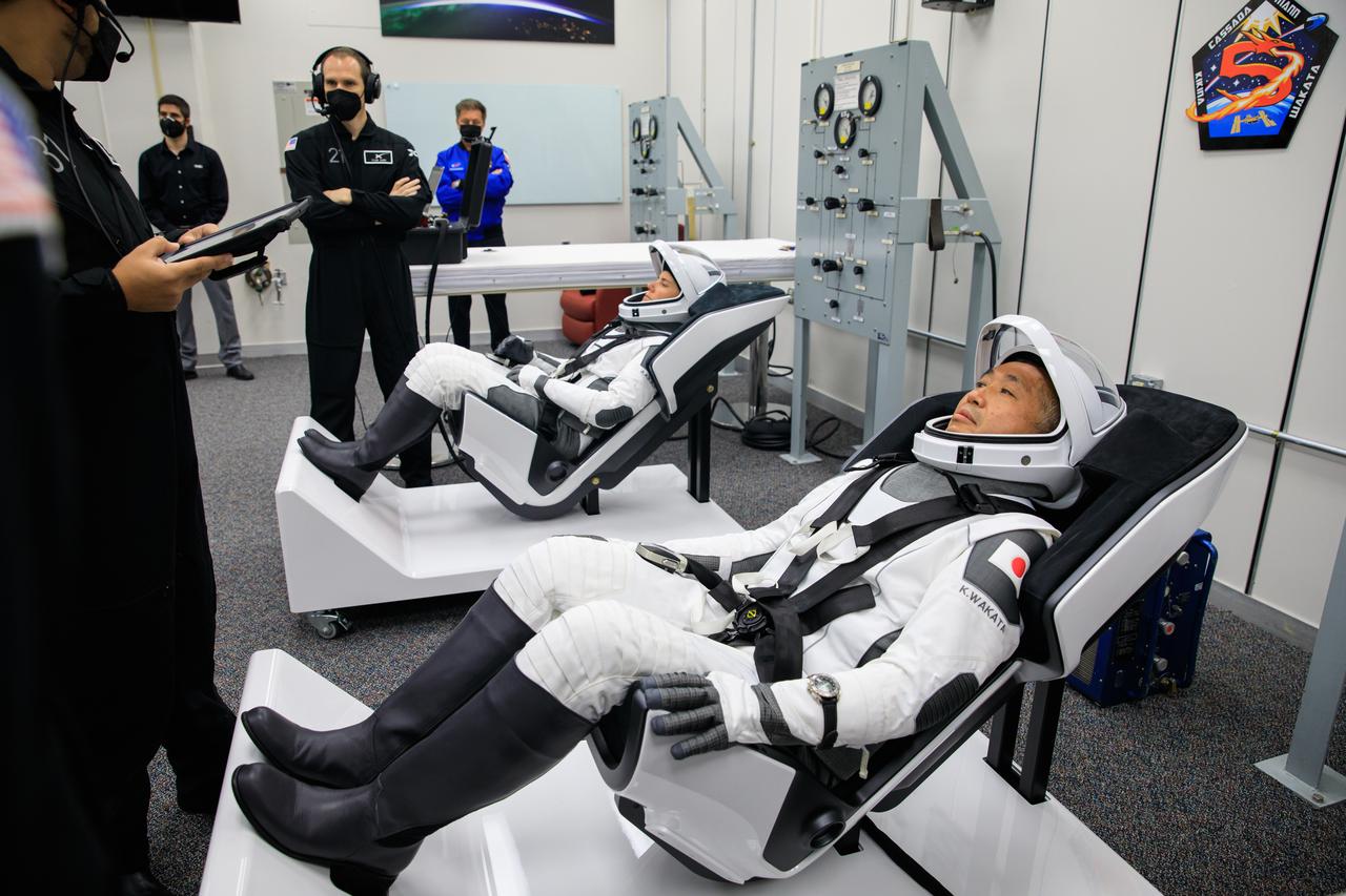 Roscosmos cosmonaut Anna Kikina, left, and JAXA (Japan Aerospace Exploration Agency) astronaut Koichi Wakata are seated inside the crew suit-up room in the Neil A. Armstrong Operations and Checkout Building at NASA’s Kennedy Space Center in Florida on Oct. 5, 2022. Kikina and Wakata, along with NASA astronauts Nicole Mann and Josh Cassada, will launch to the International Space Station on the agency’s SpaceX Crew-5 mission. The SpaceX Falcon 9 rocket and Dragon Endurance spacecraft lifted off at noon EDT from Kennedy’s Launch Complex 39A.