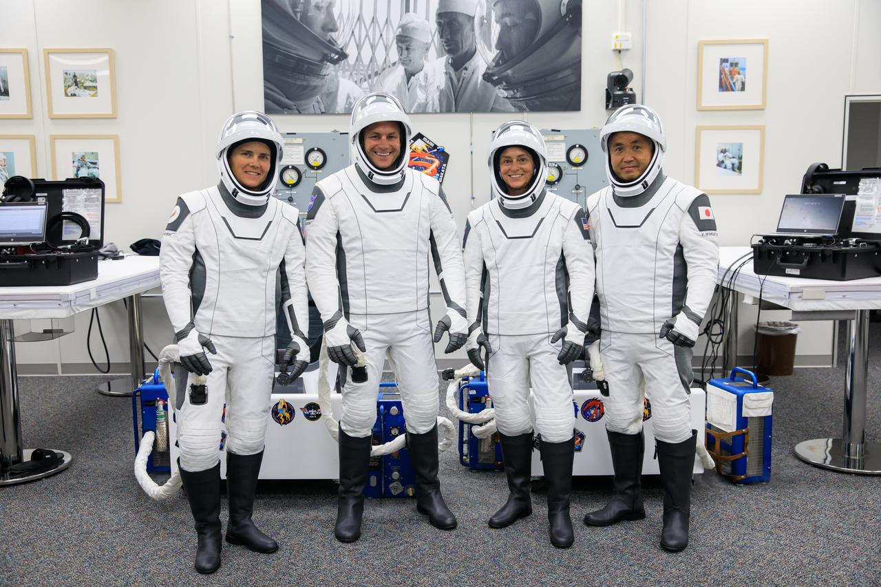 NASA’s SpaceX Crew-5 is photographed inside the crew suit-up room in the Neil A. Armstrong Operations and Checkout Building at NASA’s Kennedy Space Center in Florida ahead of the agency’s SpaceX Crew-5 launch on Oct. 5, 2022. From left are Roscosmos cosmonaut Anna Kikina, mission specialist; NASA astronauts Josh Cassada, pilot, and Nicole Mann, spacecraft commander; and JAXA (Japan Aerospace Exploration Agency) astronaut Koichi Wakata, mission specialist. The crew will launch to the International Space Station aboard SpaceX’s Dragon Endurance spacecraft for a science expedition mission as part of the agency’s Commercial Crew Program. SpaceX’s Falcon 9 rocket lifted off at noon EDT from Kennedy’s Launch Complex 39A.