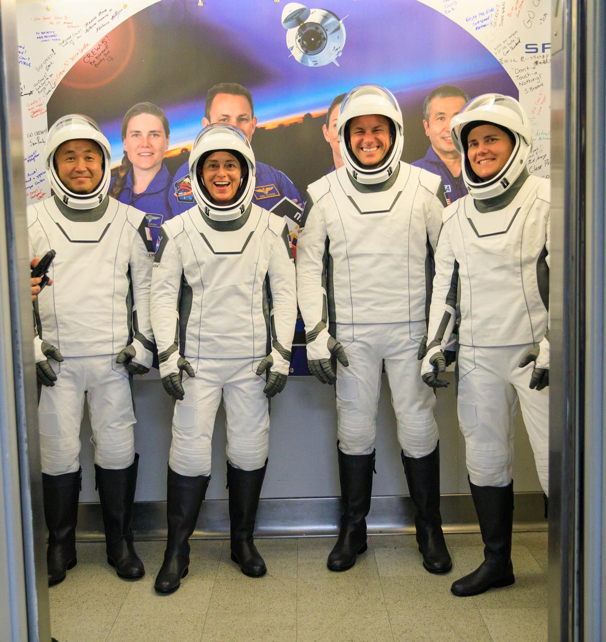 NASA’s SpaceX Crew-5 enters the elevator inside the Neil A. Armstrong Operations and Checkout Building at NASA’s Kennedy Space Center in Florida on Oct. 5, 2022. From left are JAXA (Japan Aerospace Exploration Agency) Koichi Wakata, mission specialist; NASA astronauts Nicole Mann, spacecraft commander, and Josh Cassada, pilot; and Roscosmos cosmonaut Anna Kikina, mission specialist. The crew will launch to the International Space Station aboard SpaceX’s Dragon Endurance spacecraft for a science expedition mission as part of the agency’s Commercial Crew Program. SpaceX’s Falcon 9 rocket lifted off at noon EDT from Kennedy’s Launch Complex 39A.