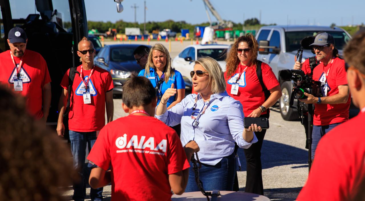 Leah Martin, in the center, NASA Communications, speaks to students and their chaperones during a tour of NASA’s Kennedy Space Center in Florida on Oct. 6, 2022. The middle-school students, from the Boys and Girls Clubs of the Flathead Indian Reservation and lake in Montana, are visiting the space center with the Students to Launch program. Students to Launch engages students in STEM (science, technology, engineering and mathematics) and creates awareness of careers in the space program. 