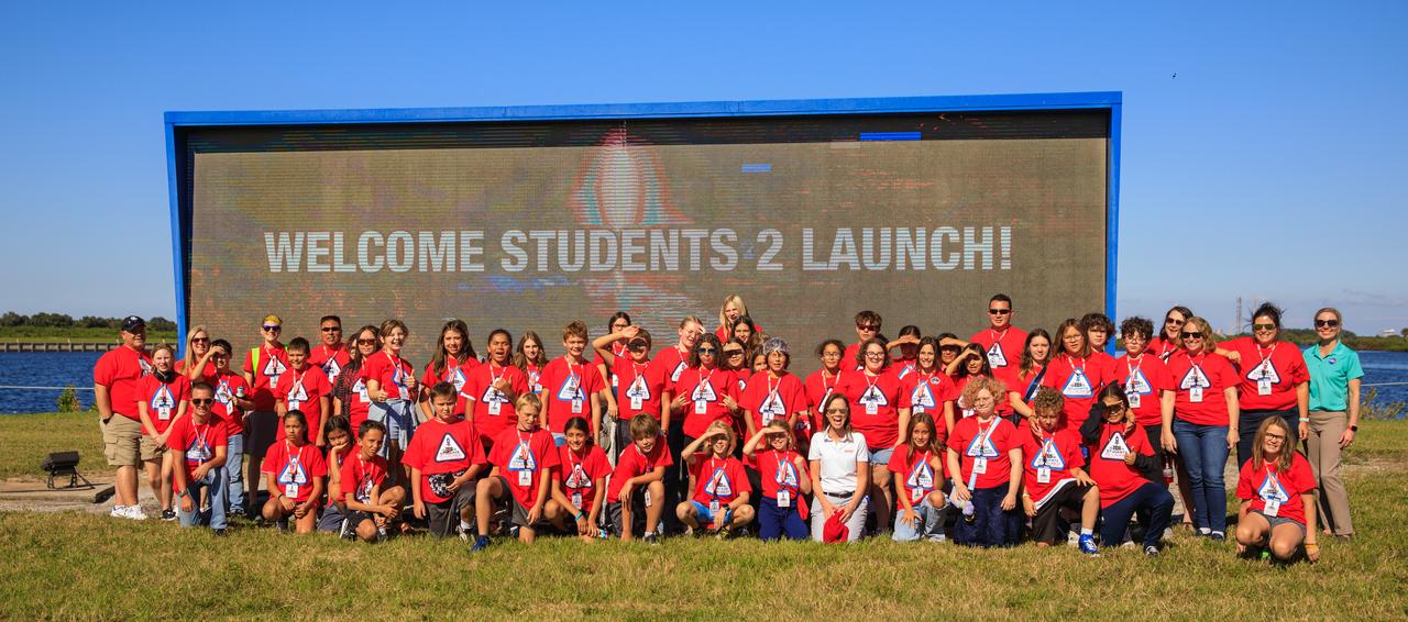 A group of students and their chaperones gather for a photo at the launch countdown clock near the News Center at NASA’s Kennedy Space Center in Florida on Oct. 6, 2022. The middle-school students, from the Boys and Girls Clubs of the Flathead Indian Reservation in Montana, are visiting the space center with the Students to Launch program. Students to Launch is engages students in STEM (science, technology, engineering and mathematics) and creates awareness of careers in the space program. 