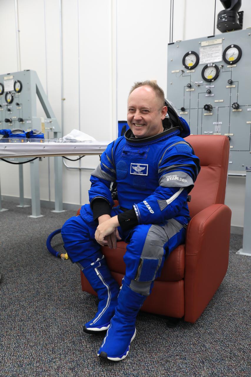 NASA astronaut Mike Fincke, Boeing Crew Flight Test (CFT) backup spacecraft test pilot, checks his spacesuit during a crew validation test inside the Astronaut Crew Quarters at NASA’s Kennedy Space Center in Florida on Oct. 18, 2022. Fincke, along with NASA astronauts Suni Williams and Barry “Butch” Wilmore, CTF pilot and commander, respectively, with assistance from the Boeing team, successfully completed the validation test during which they suited up and tested out the pressurized crew module to ensure seat fit, suit functionality, cabin temperature, audio system, and day of launch operations. Boeing’s CFT is scheduled to launch in April 2023. 