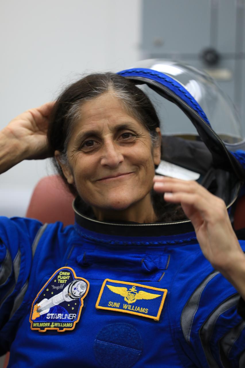 NASA astronaut Suni Williams, pilot for Boeing’s Crew Flight Test (CFT), checks her spacesuit and helmet during a crew validation test inside the Astronaut Crew Quarters at NASA’s Kennedy Space Center in Florida on Oct. 18, 2022. Williams, along with NASA astronauts Barry “Butch” Wilmore, CFT commander, and Mike Fincke, CFT backup spacecraft test pilot, with assistance from the Boeing team, successfully completed the validation test during which they suited up and tested out the pressurized crew module to ensure seat fit, suit functionality, cabin temperature, audio system, and day of launch operations. Boeing’s CFT is scheduled to launch in April 2023.