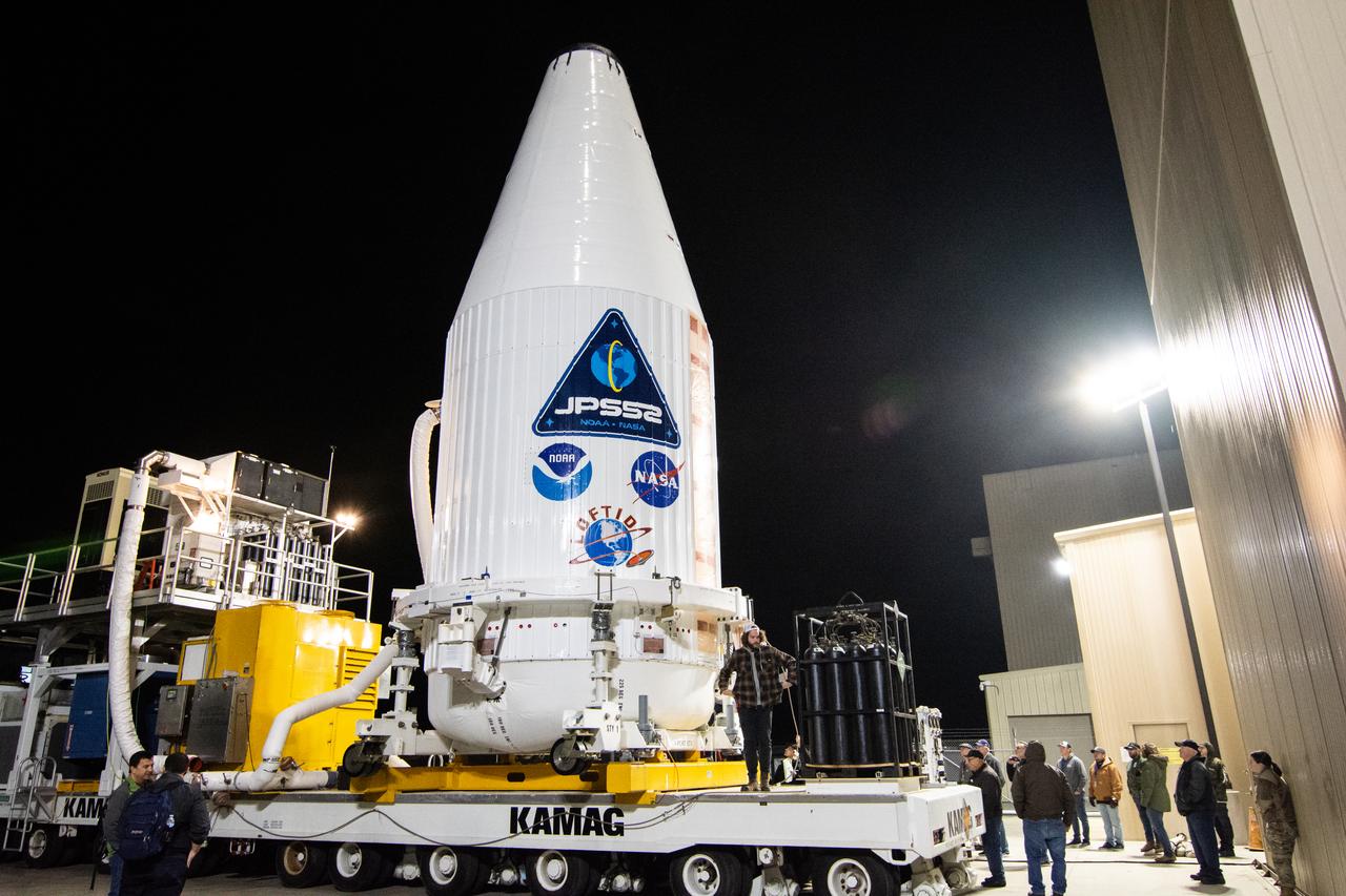 The United Launch Alliance Atlas V payload fairing containing the National Oceanic and Atmospheric Administration’s (NOAA) Joint Polar Satellite System-2 (JPSS-2) begins its journey to the vertical integration facility at Space Launch Complex 3 at Vandenberg Space Force Base (VSFB) in California on Oct. 18, 2022. Inside the fairing, JPSS-2 is stacked atop NASA’s Low-Earth Orbit Flight Test of an Inflatable Decelerator (LOFTID) secondary payload. JPSS-2 is the third satellite in the Joint Polar Satellite System series. It is scheduled to lift off from VSFB on Nov. 1 from SLC-3. JPSS-2, which will be renamed NOAA-21 after reaching orbit, will join a constellation of JPSS satellites that orbit from the North to the South pole, circling Earth 14 times a day and providing a full view of the entire globe twice daily. The NOAA/NASA Suomi National Polar-orbiting Partnership (Suomi NPP) satellite, and NOAA-20, previously known as JPSS-1, are both already in orbit. Each satellite carries at least four advanced instruments to measure weather and climate conditions on Earth. LOFTID is dedicated to the memory of Bernard Kutter. LOFTID will demonstrate inflatable heat shield technology that could enable a variety of proposed NASA missions to destinations such as Mars, Venus, and Titan, as well as returning heavier payloads from low-Earth orbit. 