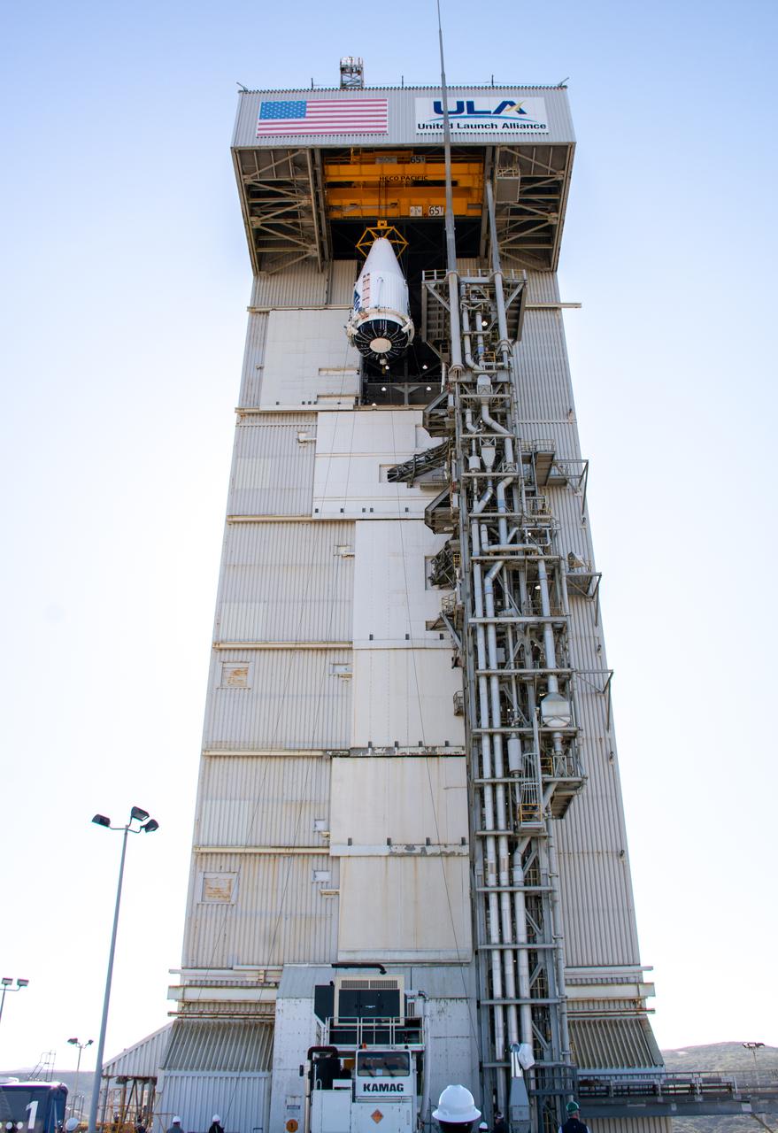 The United Launch Alliance Atlas V payload fairing containing the National Oceanic and Atmospheric Administration’s (NOAA) Joint Polar Satellite System-2 (JPSS-2) is lifted high for transfer into the vertical integration facility at Space Launch Complex 3 at Vandenberg Space Force Base (VSFB) in California on Oct. 18, 2022. Inside the fairing, JPSS-2 is stacked atop NASA’s Low-Earth Orbit Flight Test of an Inflatable Decelerator (LOFTID) secondary payload. JPSS-2 is the third satellite in the Joint Polar Satellite System series. It is scheduled to lift off from VSFB on Nov. 1 from SLC-3. JPSS-2, which will be renamed NOAA-21 after reaching orbit, will join a constellation of JPSS satellites that orbit from the North to the South pole, circling Earth 14 times a day and providing a full view of the entire globe twice daily. The NOAA/NASA Suomi National Polar-orbiting Partnership (Suomi NPP) satellite, and NOAA-20, previously known as JPSS-1, are both already in orbit. Each satellite carries at least four advanced instruments to measure weather and climate conditions on Earth. LOFTID is dedicated to the memory of Bernard Kutter. LOFTID will demonstrate inflatable heat shield technology that could enable a variety of proposed NASA missions to destinations such as Mars, Venus, and Titan, as well as returning heavier payloads from low-Earth orbit. 