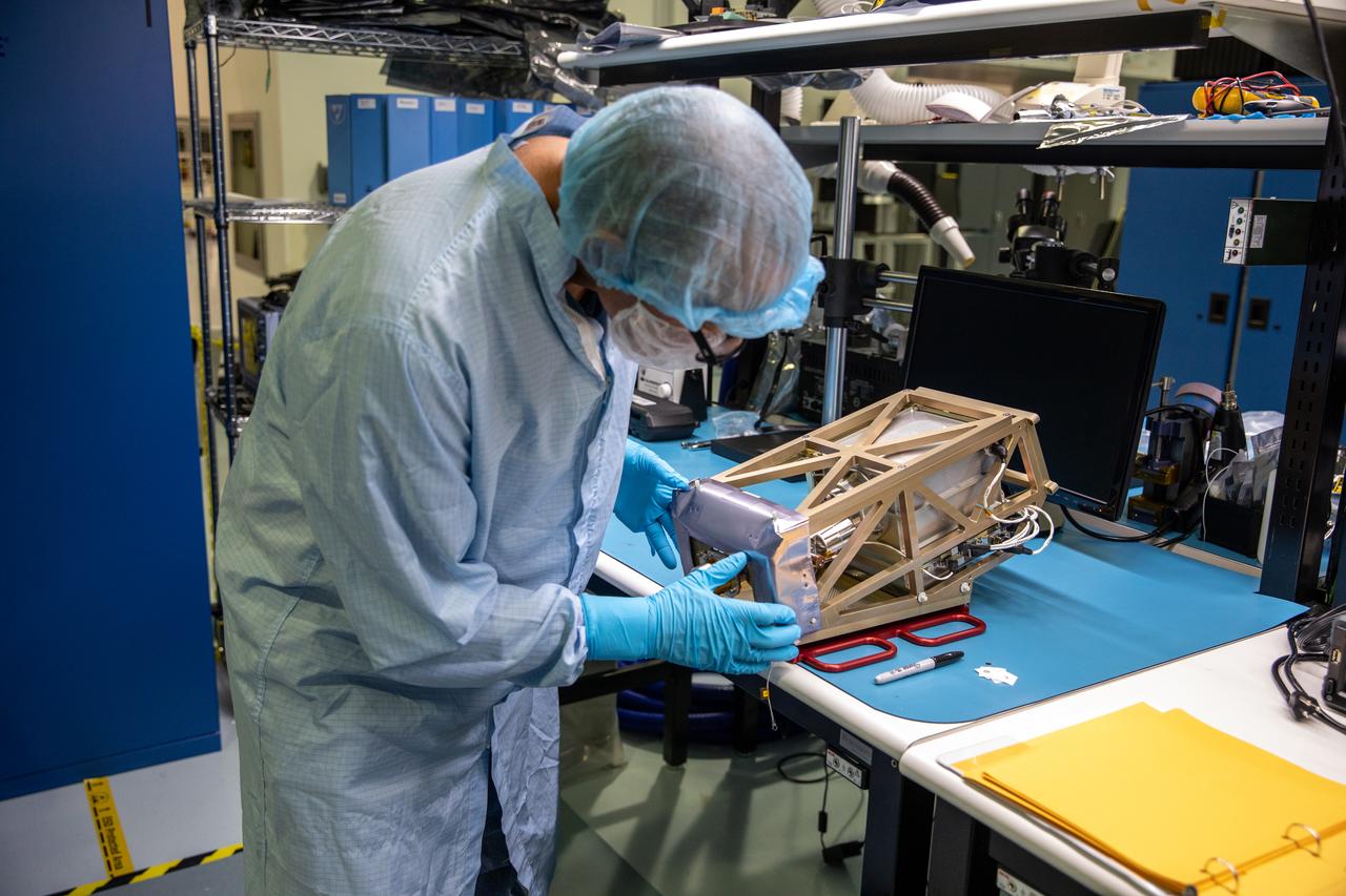 Engineers prepare the Mass Spectrometer Observing Lunar Operations (MSolo) instrument for the multilayer insulation installation inside Kennedy Space Center’s Space Station Processing Facility on Oct. 19, 2022. The activity is in preparation for the Polar Resources Ice Mining Experiment-1 (PRIME-1) mission, which will be the first in-situ resource utilization demonstration on the Moon. MSolo is a commercial off-the-shelf mass spectrometer modified to work in space and will help analyze the chemical makeup of landing sites on the Moon, as well as study water on the lunar surface. Researchers and engineers are preparing MSolo instruments to launch on four robotic missions as part of NASA’s Commercial Lunar Payload Services – commercial deliveries beginning in 2023 that will perform science experiments, test technologies, and demonstrate capabilities to help NASA explore the Moon and prepare for crewed missions to the lunar surface.