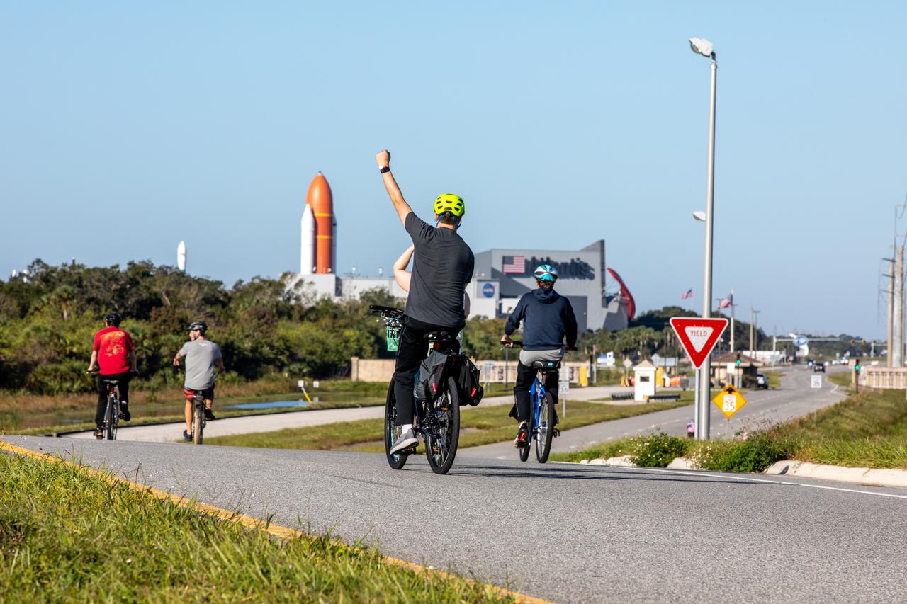 Kennedy Space Center employees and their guests return to the Kennedy Space Center Visitor Complex after completing the Diamond Tour de KSC at the NASA spaceport in Florida on Oct. 22, 2022. This unique event, held for the first time since 2019, was part of the Safety organization’s Fall Into Safety and Health event, and named “diamond” to honor the center’s 60th anniversary. Cyclists covered three different routes and rode by historic landmarks, completing a total of about 37 miles. 