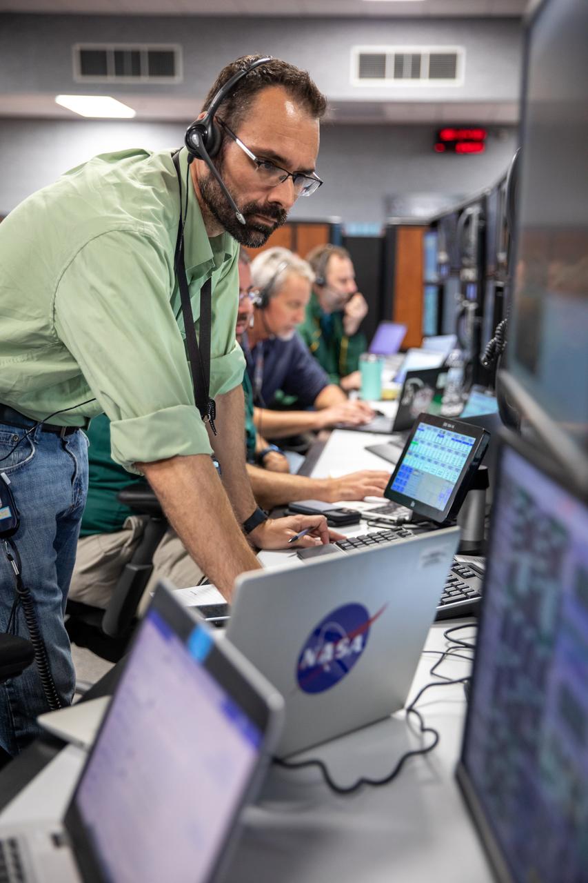 Anton Kiriwas, a launch project engineer for the Artemis I mission, monitors operations from his position in Firing Room 1 as Artemis teams conduct a launch simulation for the Artemis I launch inside the Rocco A. Petrone Launch Control Center at NASA’s Kennedy Space Center in Florida on Oct. 27, 2022. Artemis I will be the first integrated test of NASA’s Space Launch System (SLS) rocket and Orion spacecraft. The primary goal of Artemis I is to thoroughly test the integrated systems before crewed missions by launching Orion atop the SLS rocket, operating the spacecraft in a deep space environment, testing Orion’s heat shield, and recovering the crew module after reentry, descent, and splashdown. During the flight, Orion will launch atop the most powerful rocket in the world and fly farther than any human-rated spacecraft has ever flown, paving the way for human deep space exploration and demonstrating our commitment and capability to extend human presence to the Moon and beyond. 