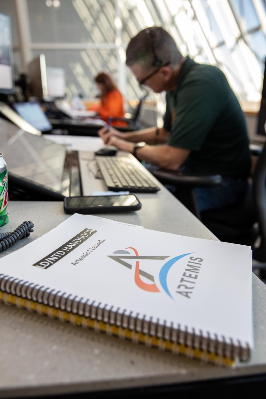 Assistant Launch Director Jeremy Graeber (foreground) and Launch Director Charlie Blackwell-Thompson (background) monitor operations from their positions in Firing Room 1 as Artemis teams conduct a launch simulation for the Artemis I mission inside the Rocco A. Petrone Launch Control Center at NASA’s Kennedy Space Center in Florida on Oct. 27, 2022. Artemis I will be the first integrated test of NASA’s Space Launch System (SLS) rocket and Orion spacecraft. The primary goal of Artemis I is to thoroughly test the integrated systems before crewed missions by launching Orion atop the SLS rocket, operating the spacecraft in a deep space environment, testing Orion’s heat shield, and recovering the crew module after reentry, descent, and splashdown. During the flight, Orion will launch atop the most powerful rocket in the world and fly farther than any human-rated spacecraft has ever flown, paving the way for human deep space exploration and demonstrating our commitment and capability to extend human presence to the Moon and beyond. 
