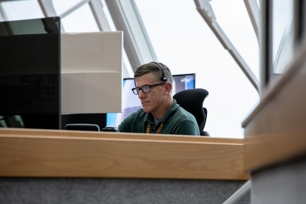 Assistant Launch Director Jeremy Graeber monitors operations from his position in Firing Room 1 as Artemis teams conduct a launch simulation for the Artemis I mission inside the Rocco A. Petrone Launch Control Center at NASA’s Kennedy Space Center in Florida on Oct. 27, 2022. Artemis I will be the first integrated test of NASA’s Space Launch System (SLS) rocket and Orion spacecraft. The primary goal of Artemis I is to thoroughly test the integrated systems before crewed missions by launching Orion atop the SLS rocket, operating the spacecraft in a deep space environment, testing Orion’s heat shield, and recovering the crew module after reentry, descent, and splashdown. During the flight, Orion will launch atop the most powerful rocket in the world and fly farther than any human-rated spacecraft has ever flown, paving the way for human deep space exploration and demonstrating our commitment and capability to extend human presence to the Moon and beyond. 
