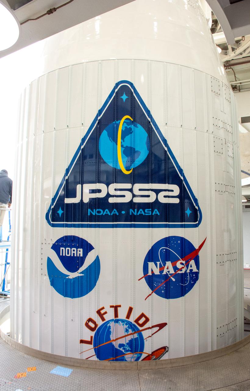 A close-up view of the United Launch Alliance Atlas V payload fairing containing the National Oceanic and Atmospheric Administration’s (NOAA) Joint Polar Satellite System-2 (JPSS-2) and NASA’s Low-Earth Orbit Flight Test of an Inflatable Decelerator (LOFTID) inside the mobile service tower at Space Launch Complex-3 (SLC-3) at Vandenberg Space Force Base in California on Oct. 28, 2022. NASA and ULA are targeting launch for no earlier than Wednesday, Nov. 9, pending range availability. JPSS-2, which will be renamed NOAA-21 after reaching orbit, will join a constellation of JPSS satellites that orbit from the North to the South pole, circling Earth 14 times a day. The NOAA/NASA Suomi National Polar-orbiting Partnership (Suomi NPP) satellite, and NOAA-20, previously known as JPSS-1, are both already in orbit. Each satellite carries at least four advanced instruments to measure weather and climate conditions on Earth. LOFTID will demonstrate inflatable heat shield technology that could enable a variety of proposed NASA missions to destinations such as Mars, Venus, and Titan, as well as returning heavier payloads from low-Earth orbit. 