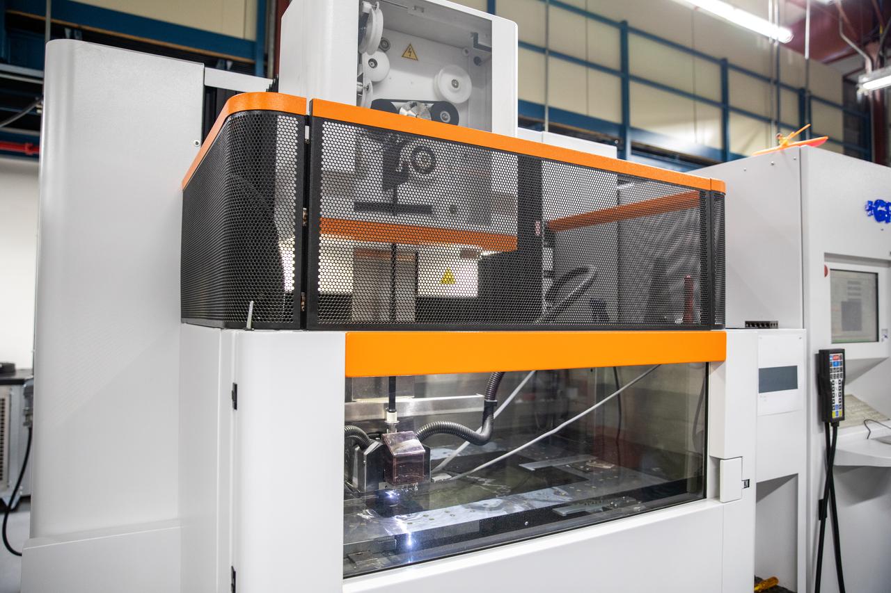 Testing of the Plasma Rapid Oxidation Technique for Extending Component Tenability (PROTECT) experiment is underway inside the Prototype Development Laboratory at NASA’s Kennedy Space Center in Florida on Nov. 2, 2022. Plasma electrolytic oxidation is a surface coating technology that produces oxide layers on the surface of light metals and their alloys to improve their performance characteristics. These  coatings are tailored to provide a combination of characteristics such as corrosion protection, wear resistance, thermal management, extreme hardness, and fatigue performance. PROTECT is expected to demonstrate a ten percent improved fatigue performance and a 70 percent improvement in corrosion characteristics on the interior of treated 3-D printed metallic parts when compared to non-treated parts. PROTECT could be applied on spacecraft and launch vehicles. 