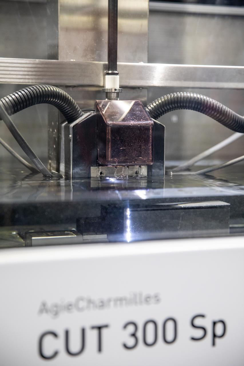 Testing of the Plasma Rapid Oxidation Technique for Extending Component Tenability (PROTECT) experiment is underway inside the Prototype Development Laboratory at NASA’s Kennedy Space Center in Florida on Nov. 2, 2022. Plasma electrolytic oxidation is a surface coating technology that produces oxide layers on the surface of light metals and their alloys to improve their performance characteristics. These coatings are tailored to provide a combination of characteristics such as corrosion protection, wear resistance, thermal management, extreme hardness, and fatigue performance. PROTECT is expected to demonstrate a 10 percent improved fatigue performance and a 70 percent improvement in corrosion characteristics on the interior of treated 3-D printed metallic parts when compared to non-treated parts. PROTECT could be applied on spacecraft and launch vehicles. 