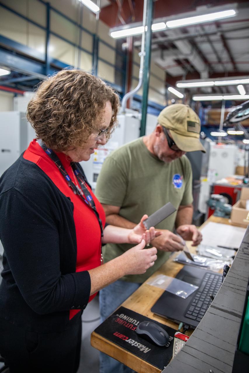 From left, Dr. Jennifer Williams, a NASA research chemical engineer, and Gerard Moscoso, a mechanical engineer technician, inspect specimens prepared forthe Plasma Rapid Oxidation Technique for Extending Component Tenability (PROTECT) experiment inside the Prototype Development Laboratory at NASA’s Kennedy Space Center in Florida on Nov. 2, 2022. Plasma electrolytic oxidation is a surface coating technology that produces oxide layers on the surface of light metals and their alloys to improve their performance characteristics. These coatings are tailored to provide a combination of characteristics such as corrosion protection, wear resistance, thermal management, extreme hardness, and fatigue performance. PROTECT is expected to demonstrate a 10 percent improved fatigue performance and a 70 percent improvement in corrosion characteristics on the interior of treated 3-D printed metallic parts when compared to non-treated parts. PROTECT could be applied used on spacecraft and launch vehicles. 