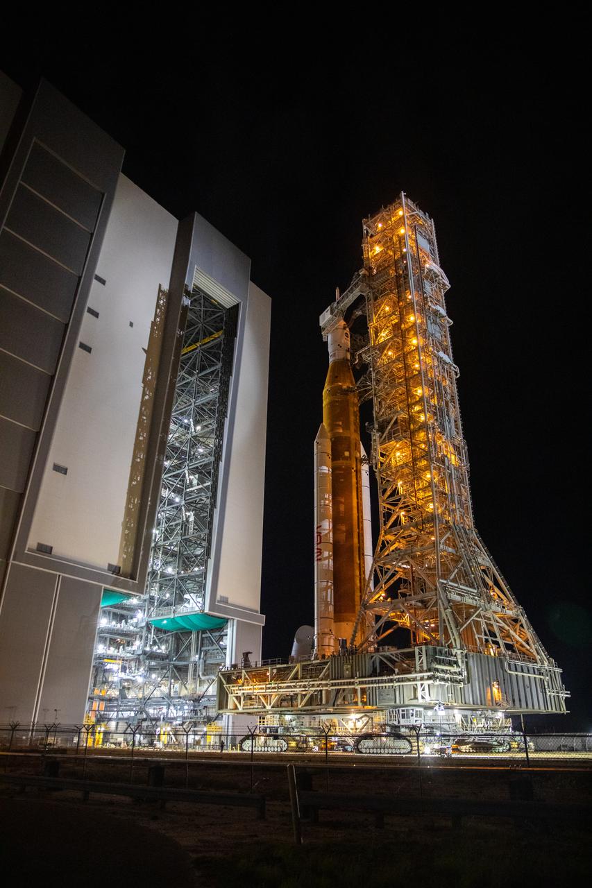 The mobile launcher, with NASA’s Space Launch System (SLS) rocket and Orion spacecraft atop, rolls out of the Vehicle Assembly Building’s High Bay 3 to begin its 4.2-mile journey to Launch Pad 39B at NASA’s Kennedy Space Center in Florida on Nov. 4, 2022. Artemis I will be the first integrated test of NASA’s SLS rocket and Orion spacecraft and is scheduled to launch Monday, Nov. 14. The primary goal of Artemis I is to thoroughly test the integrated systems before crewed missions by launching Orion atop the SLS rocket, operating the spacecraft in a deep space environment, testing Orion’s heat shield, and recovering the crew module after reentry, descent, and splashdown. During the flight, Orion will launch atop the most powerful rocket in the world and fly farther than any human-rated spacecraft has ever flown, paving the way for human deep space exploration and demonstrating our commitment and capability to extend human presence to the Moon and beyond.