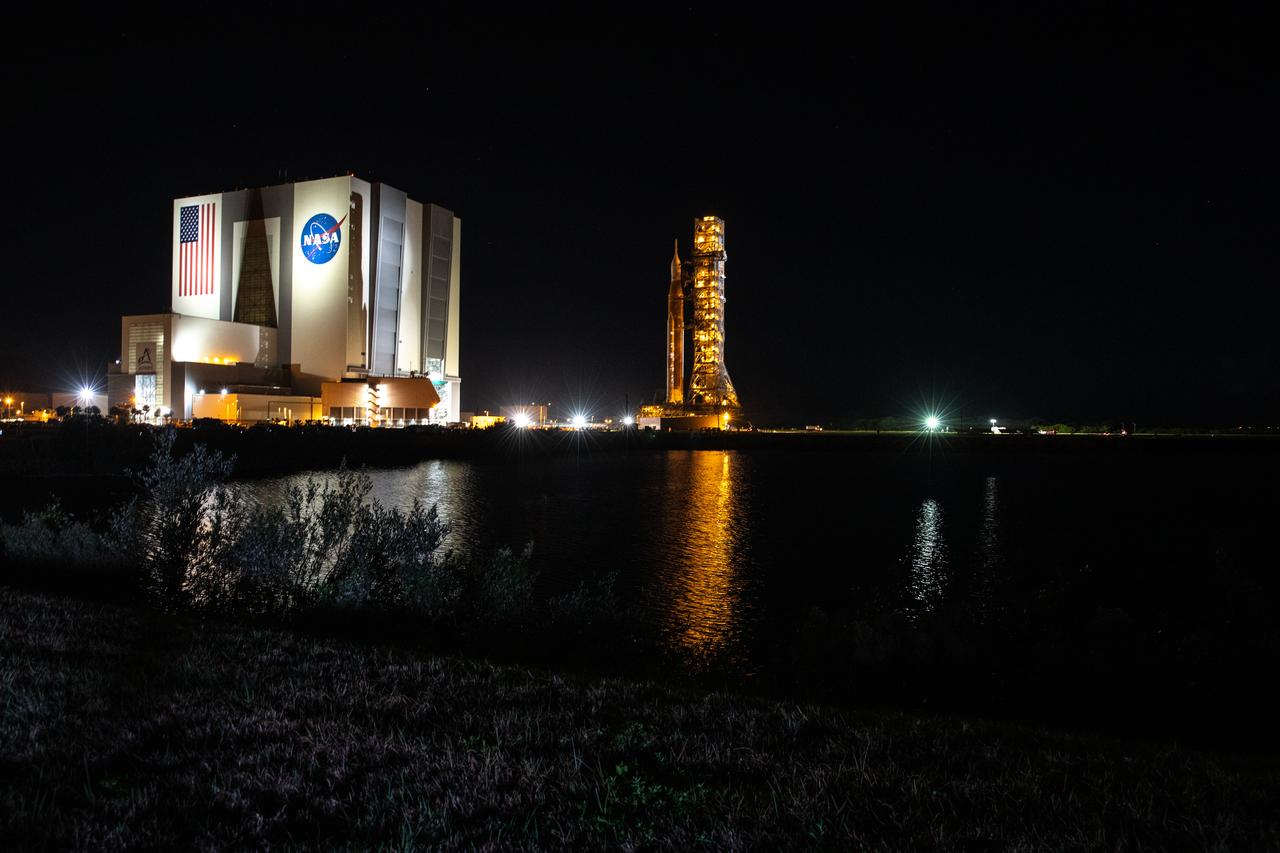 The mobile launcher, with NASA’s Space Launch System (SLS) rocket and Orion spacecraft atop, rolls out of the Vehicle Assembly Building’s High Bay 3 to begin its 4.2-mile journey to Launch Pad 39B at NASA’s Kennedy Space Center in Florida on Nov. 4, 2022. Artemis I will be the first integrated test of NASA’s SLS rocket and Orion spacecraft and is scheduled to launch Monday, Nov. 14. The primary goal of Artemis I is to thoroughly test the integrated systems before crewed missions by launching Orion atop the SLS rocket, operating the spacecraft in a deep space environment, testing Orion’s heat shield, and recovering the crew module after reentry, descent, and splashdown. During the flight, Orion will launch atop the most powerful rocket in the world and fly farther than any human-rated spacecraft has ever flown, paving the way for human deep space exploration and demonstrating our commitment and capability to extend human presence to the Moon and beyond.