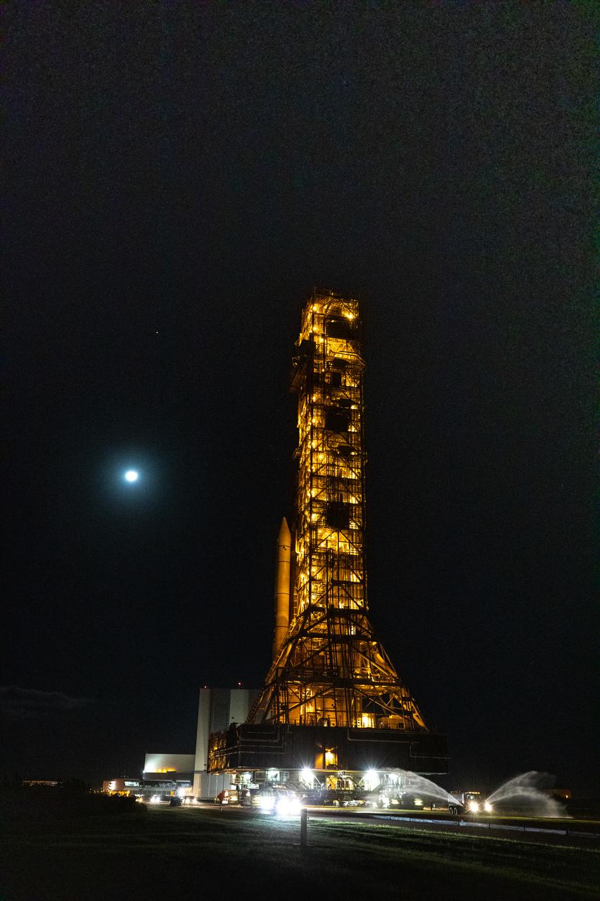 NASA’s Space Launch System (SLS) rocket, with the Orion spacecraft atop, slowly makes its way along the crawlerway at the agency’s Kennedy Space Center in Florida on Nov. 4, 2022. Carried by the crawler-transporter 2, NASA’s Moon rocket is venturing the 4.2 miles from the Vehicle Assembly Building to Launch Pad 39B for the Artemis I launch, scheduled for Monday, Nov. 14. Artemis I will be the first integrated test of NASA’s SLS rocket and Orion spacecraft. The primary goal of Artemis I is to thoroughly test the integrated systems before crewed missions by launching Orion atop the SLS rocket, operating the spacecraft in a deep space environment, testing Orion’s heat shield, and recovering the crew module after reentry, descent, and splashdown. During the flight, Orion will launch atop the most powerful rocket in the world and fly farther than any human-rated spacecraft has ever flown, paving the way for human deep space exploration and demonstrating our commitment and capability to extend human presence to the Moon and beyond.