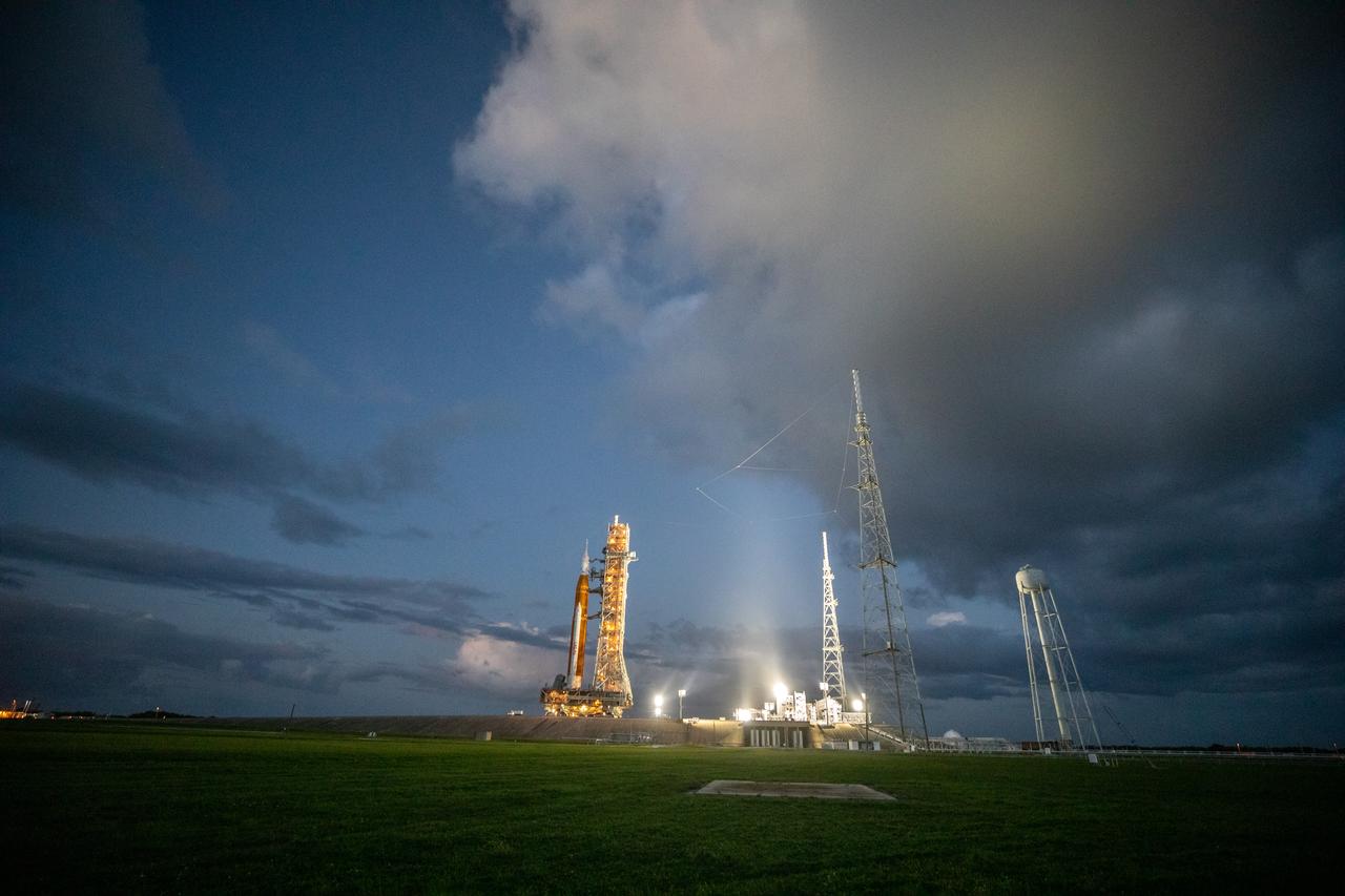 NASA’s Space Launch System (SLS) rocket and Orion spacecraft, standing atop the mobile launcher, arrive at Launch Pad 39B at the agency’s Kennedy Space Center in Florida on Nov. 4, 2022, ahead of the uncrewed Artemis I launch. Artemis I will be the first integrated test of NASA’s SLS rocket and Orion spacecraft and is scheduled to launch Monday, Nov. 14. The primary goal of Artemis I is to thoroughly test the integrated systems before crewed missions by launching Orion atop the SLS rocket, operating the spacecraft in a deep space environment, testing Orion’s heat shield, and recovering the crew module after reentry, descent, and splashdown. During the flight, Orion will launch atop the most powerful rocket in the world and fly farther than any human-rated spacecraft has ever flown, paving the way for human deep space exploration and demonstrating our commitment and capability to extend human presence to the Moon and beyond.