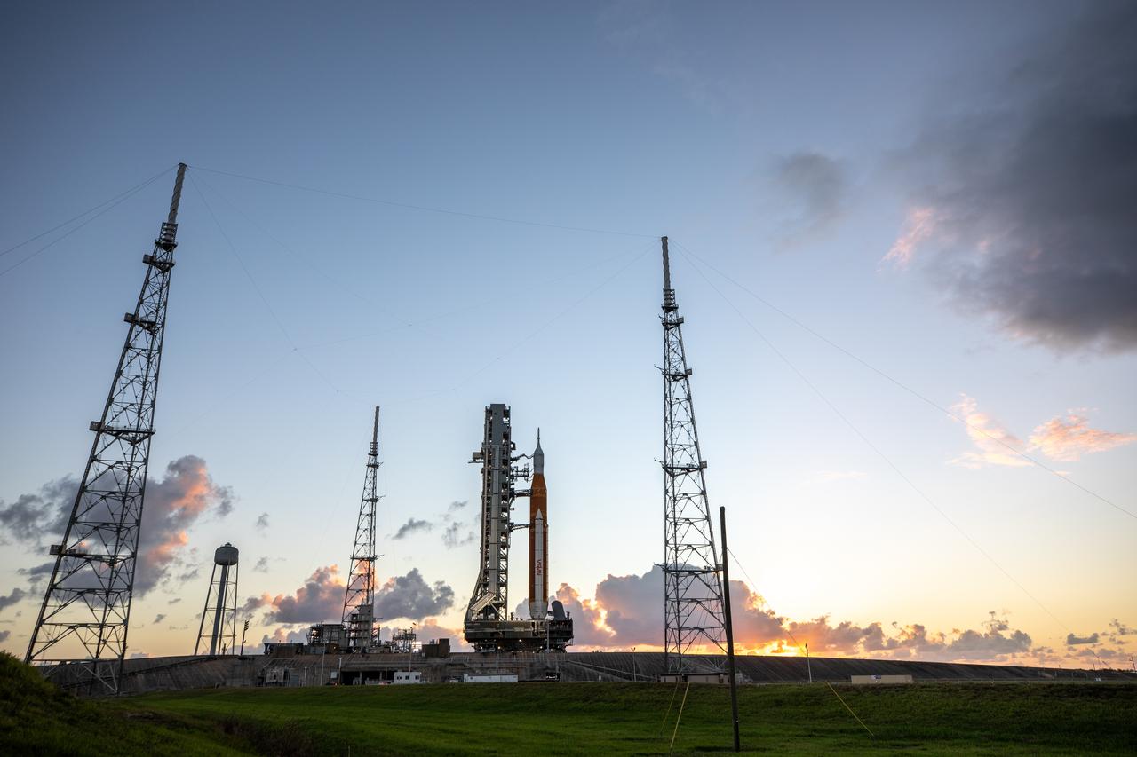 NASA’s Space Launch System (SLS) rocket and Orion spacecraft, standing atop the mobile launcher, arrive at Launch Pad 39B at the agency’s Kennedy Space Center in Florida on Nov. 4, 2022, ahead of the uncrewed Artemis I launch. Artemis I will be the first integrated test of NASA’s SLS rocket and Orion spacecraft and is scheduled to launch Monday, Nov. 14. The primary goal of Artemis I is to thoroughly test the integrated systems before crewed missions by launching Orion atop the SLS rocket, operating the spacecraft in a deep space environment, testing Orion’s heat shield, and recovering the crew module after reentry, descent, and splashdown. During the flight, Orion will launch atop the most powerful rocket in the world and fly farther than any human-rated spacecraft has ever flown, paving the way for human deep space exploration and demonstrating our commitment and capability to extend human presence to the Moon and beyond.