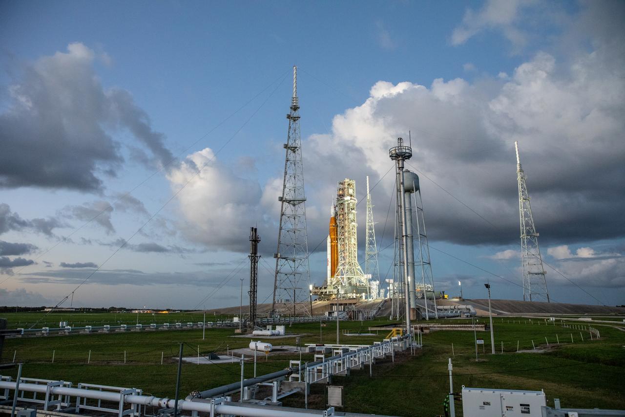 NASA’s Space Launch System (SLS) rocket and Orion spacecraft, standing atop the mobile launcher, arrive at Launch Pad 39B at the agency’s Kennedy Space Center in Florida on Nov. 4, 2022, ahead of the uncrewed Artemis I launch. Artemis I will be the first integrated test of NASA’s SLS rocket and Orion spacecraft and is scheduled to launch Monday, Nov. 14. The primary goal of Artemis I is to thoroughly test the integrated systems before crewed missions by launching Orion atop the SLS rocket, operating the spacecraft in a deep space environment, testing Orion’s heat shield, and recovering the crew module after reentry, descent, and splashdown. During the flight, Orion will launch atop the most powerful rocket in the world and fly farther than any human-rated spacecraft has ever flown, paving the way for human deep space exploration and demonstrating our commitment and capability to extend human presence to the Moon and beyond.