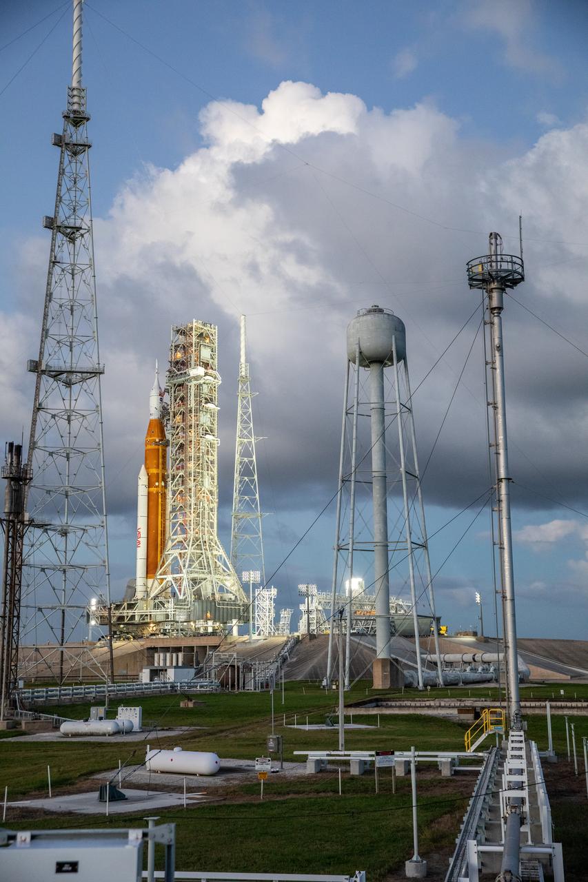 NASA’s Space Launch System (SLS) rocket and Orion spacecraft, standing atop the mobile launcher, arrive at Launch Pad 39B at the agency’s Kennedy Space Center in Florida on Nov. 4, 2022, ahead of the uncrewed Artemis I launch. Artemis I will be the first integrated test of NASA’s SLS rocket and Orion spacecraft and is scheduled to launch Monday, Nov. 14. The primary goal of Artemis I is to thoroughly test the integrated systems before crewed missions by launching Orion atop the SLS rocket, operating the spacecraft in a deep space environment, testing Orion’s heat shield, and recovering the crew module after reentry, descent, and splashdown. During the flight, Orion will launch atop the most powerful rocket in the world and fly farther than any human-rated spacecraft has ever flown, paving the way for human deep space exploration and demonstrating our commitment and capability to extend human presence to the Moon and beyond.