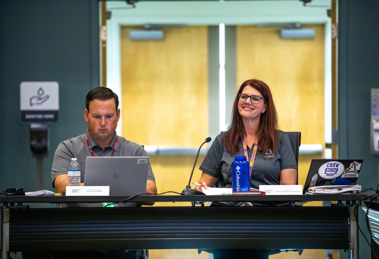 Artemis launch director, Charlie Blackwell-Thompson (right) and technical assistant to the launch director, Wes Mosedale (left) are seen at the launch pre-test briefing Nov. 12, 2022, at NASA’s Kennedy Space Center in Florida for the Artemis I mission. The first in a series of increasingly complex missions, Artemis I will provide a foundation for human deep space exploration and demonstrate our commitment and capability to extend human presence to the Moon and beyond. The primary goal of Artemis I is to thoroughly test the integrated systems before crewed missions by operating the spacecraft in a deep space environment, testing Orion’s heat shield, and recovering the crew module after reentry, descent, and splashdown.