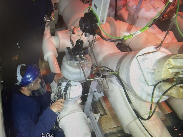 Members of the “red crew” perform work at the mobile launcher during the launch countdown for Artemis I at NASA’s Kennedy Space Center in Florida on Nov. 15, 2022. The team of technicians are part of the personnel specially trained to conduct operations at the launch pad during cryogenic loading operations. Prior to the launch of Artemis I, the red crew entered the zero deck, or base, of the mobile launcher and tightened several bolts to troubleshoot a valve used to replenish the core stage with liquid hydrogen which showed a leak with readings above limits. NASA has historically sent teams to the pad to conduct inspections during active launch operations as needed. Artemis I launched successfully at 1:47 a.m. on Nov. 16, from Kennedy’s Launch Pad 39B.