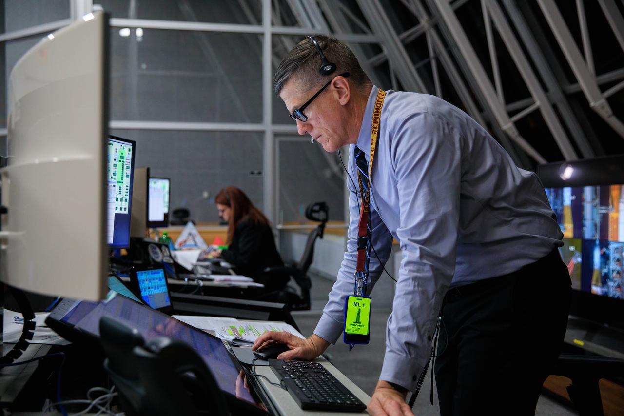 Artemis I Assistant Launch Director Jeremy Graeber monitors countdown activities inside Firing Room 1 of the Launch Control Center at NASA’s Kennedy Space Center in Florida on Nov. 16, 2022. Liftoff of the agency’s Space Launch System and Orion spacecraft from Launch Complex 39B was at 1:47 a.m. EST. The first in a series of increasingly complex missions, Artemis I will provide a foundation for human deep space exploration and demonstrate our commitment and capability to extend human presence to the Moon and beyond. The primary goal of Artemis I is to thoroughly test the integrated systems before crewed missions by operating the spacecraft in a deep space environment, testing Orion’s heat shield, and recovering the crew module after reentry, descent, and splashdown.