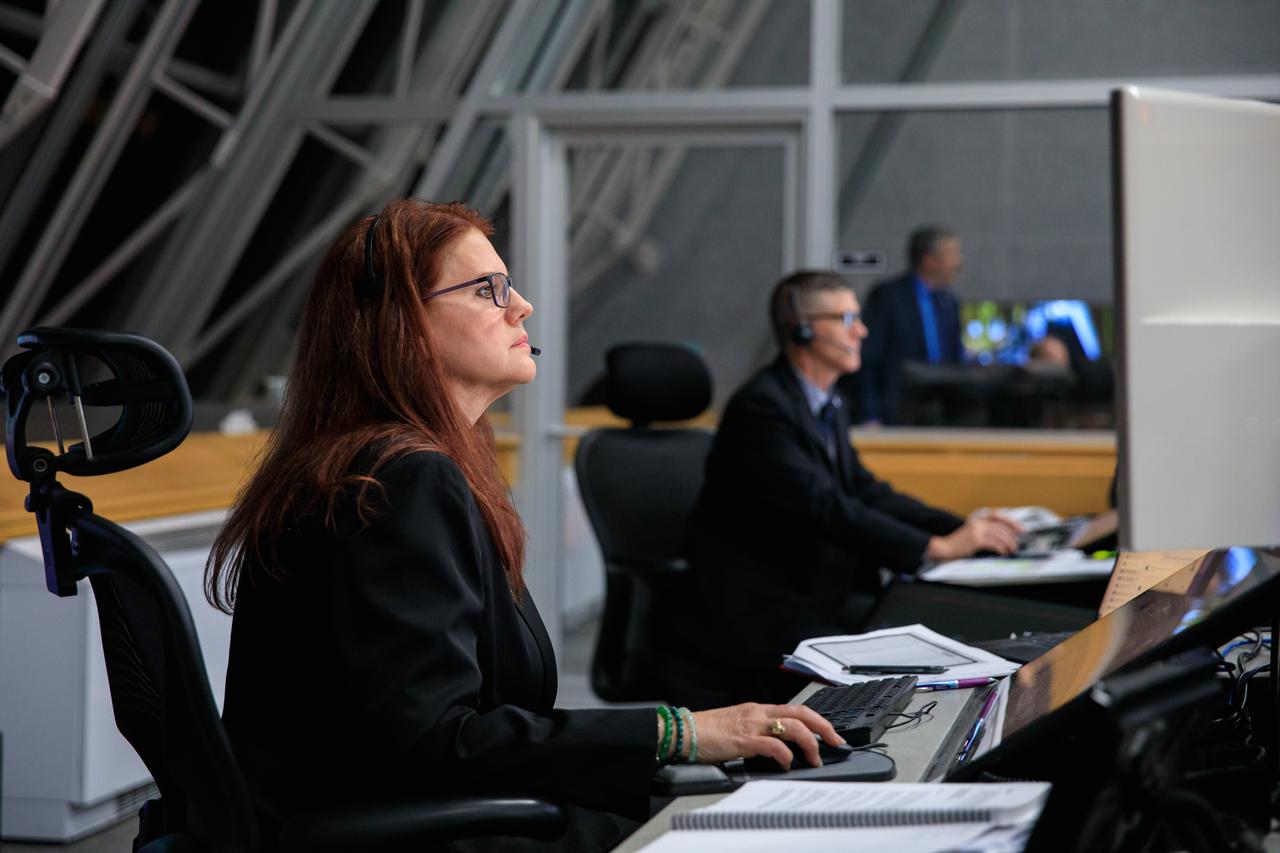 Artemis I Launch Director Charlie Blackwell-Thompson, at left, and Assistant Launch Director Jeremy Graeber, monitor launch countdown activities inside Firing Room 1 of the Launch Control Center at NASA’s Kennedy Space Center in Florida on Nov. 16, 2022. Liftoff of the agency’s Space Launch System and Orion spacecraft from Launch Complex 39B was at 1:47 a.m. EST. The first in a series of increasingly complex missions, Artemis I will provide a foundation for human deep space exploration and demonstrate our commitment and capability to extend human presence to the Moon and beyond. The primary goal of Artemis I is to thoroughly test the integrated systems before crewed missions by operating the spacecraft in a deep space environment, testing Orion’s heat shield, and recovering the crew module after reentry, descent, and splashdown.