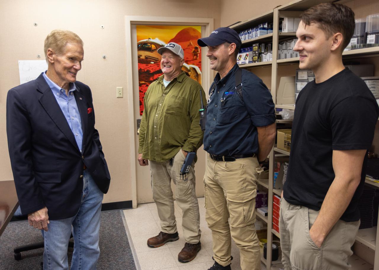 NASA Administrator Bill Nelson (left) meets with members of the “red crew,” Jacobs/TOSC ERC employees Billy Cairns (second from left), cryogenic engineering technician; Chad Garrett (second from right), safety engineer; and Trent Annis (right), cryogenic engineering technician, after the launch of Artemis I at NASA’s Kennedy Space Center in Florida on Nov. 16, 2022. The team of technicians are part of the personnel specially trained to conduct operations at the launch pad during cryogenic loading operations at the launch pad. Prior to the launch of Artemis I, the red crew entered the zero deck, or base, of the mobile launcher and tightened several bolts to troubleshoot a valve used to replenish the core stage with liquid hydrogen which showed a leak with readings above limits. NASA has historically sent teams to the pad to conduct inspections during active launch operations as needed. Artemis I launch successfully at 1:47 a.m. EST on Nov. 16, from Kennedy’s Launch Pad 39B. 