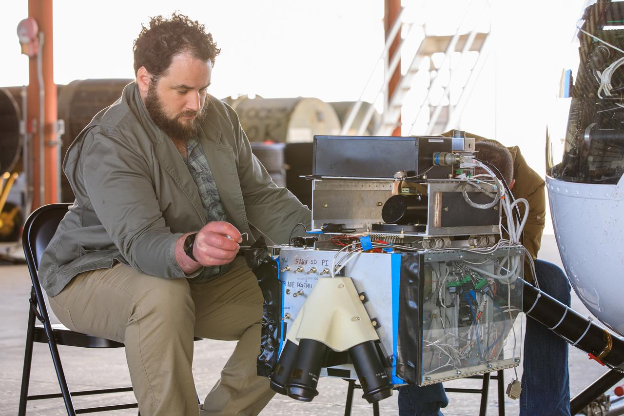 Two Intuitive Machines employees ready navigation pod sensors for the company’s Nova-C lunar lander in preparation for testing at NASA’s Kennedy Space Center in Florida on Nov. 18, 2022. The test involved flying the sensors over a simulated lunar surface at the Launch and Landing Facility on a private helicopter. Intuitive Machines is scheduled to launch two missions to the Moon in 2023 – one of which will carry NASA’s Mass Spectrometer observing lunar operations (MSolo) instrument that will help analyze the chemical makeup of landing sites on the Moon, as well as study water on the lunar surface. Through NASA’s Commercial Lunar Payload Services initiative, the agency selected Intuitive Machines to deliver science and technology demonstration payloads to the Moon, contributing to NASA’s goal of establishing a sustainable human presence on the lunar surface.