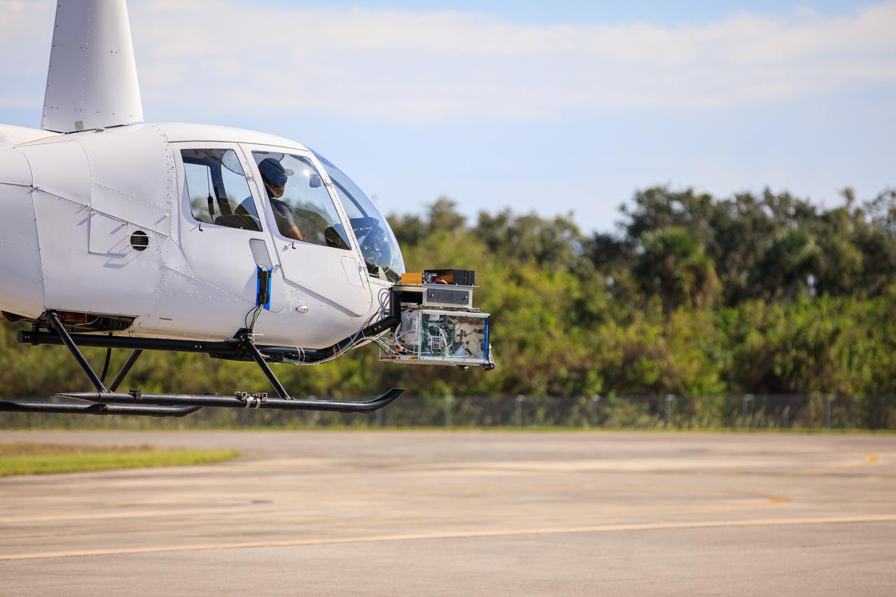 Testing of navigation pod sensors for Intuitive Machines’ Nova-C lunar lander is underway at NASA’s Kennedy Space Center in Florida on Nov. 18, 2022. The test involved flying the sensors over a simulated lunar surface at the Launch and Landing Facility on a private helicopter. Intuitive Machines is scheduled to launch two missions to the Moon in 2023 – one of which will carry NASA’s Mass Spectrometer observing lunar operations (MSolo) instrument that will help analyze the chemical makeup of landing sites on the Moon, as well as study water on the lunar surface. Through NASA’s Commercial Lunar Payload Services initiative, the agency selected Intuitive Machines to deliver science and technology demonstration payloads to the Moon, contributing to NASA’s goal of establishing a sustainable human presence on the lunar surface.