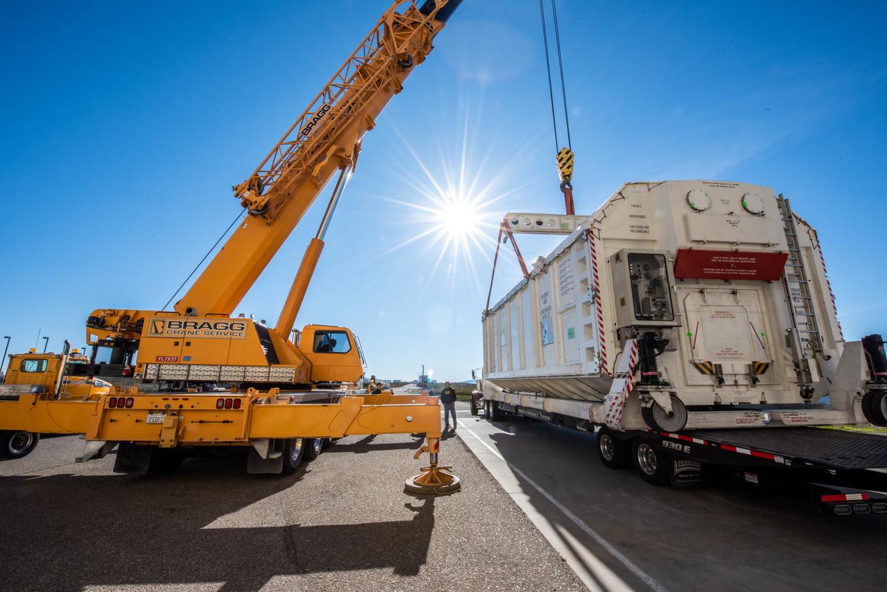 A container, with the Surface Water and Ocean Topography (SWOT) spacecraft inside, is moved to a trailer at the Astrotech facility at Vandenberg Space Force Base in California on Nov. 19, 2022. The satellite will be transported to the SpaceX facility at Vandenberg. SWOT is the first mission that will observe nearly all water on Earth’s surface, measuring the height of water in the planet’s lakes, rivers, reservoirs, and the ocean. It is set to launch aboard a SpaceX Falcon 9 rocket in December from Vandenberg’s Space Launch Center-4 East. NASA’s Launch Services Program, based at the agency’s Kennedy Space Center in Florida, is managing the launch service.