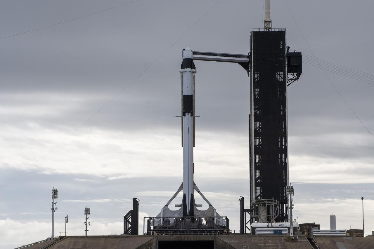 A SpaceX Falcon 9 rocket, with the company’s Dragon cargo spacecraft atop, is raised to a vertical position at NASA Kennedy Space Center’s Launch Complex 39A on Nov. 21, 2022, in preparation for the 26th commercial resupply services launch to the International Space Station. The mission will deliver new science investigations, supplies, and equipment to the crew aboard the space station, including the next pair of ISS Roll Out Solar Arrays (iROSAs). Liftoff is scheduled for 3:54 p.m. EST on Monday, Nov. 22, from Kennedy’s Launch Complex 39A.