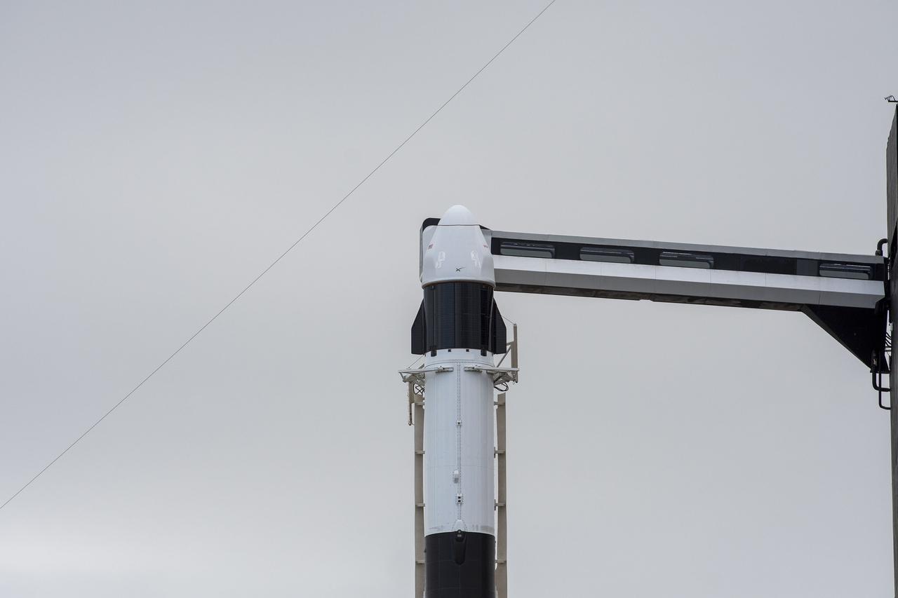 Seen here is the SpaceX Dragon cargo spacecraft atop the company’s Falcon 9 rocket after being raised to a vertical position at NASA’s Kennedy Space Center in Florida on Nov. 21, 2022, in preparation for the 26th commercial resupply services launch to the International Space Station. The mission will deliver new science investigations, supplies, and equipment to the crew aboard the space station, including the next pair of ISS Roll Out Solar Arrays (iROSAs). Liftoff is scheduled for 3:54 p.m. EST on Monday, Nov. 22, from Kennedy’s Launch Complex 39A.