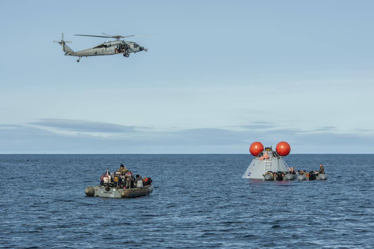 NASA's Landing and Recovery Team practices bringing a mock Orion capsule into the well deck of the USS Portland (LPD 27) ahead of the Artemis I Orion splashdown slated for Dec. 11.