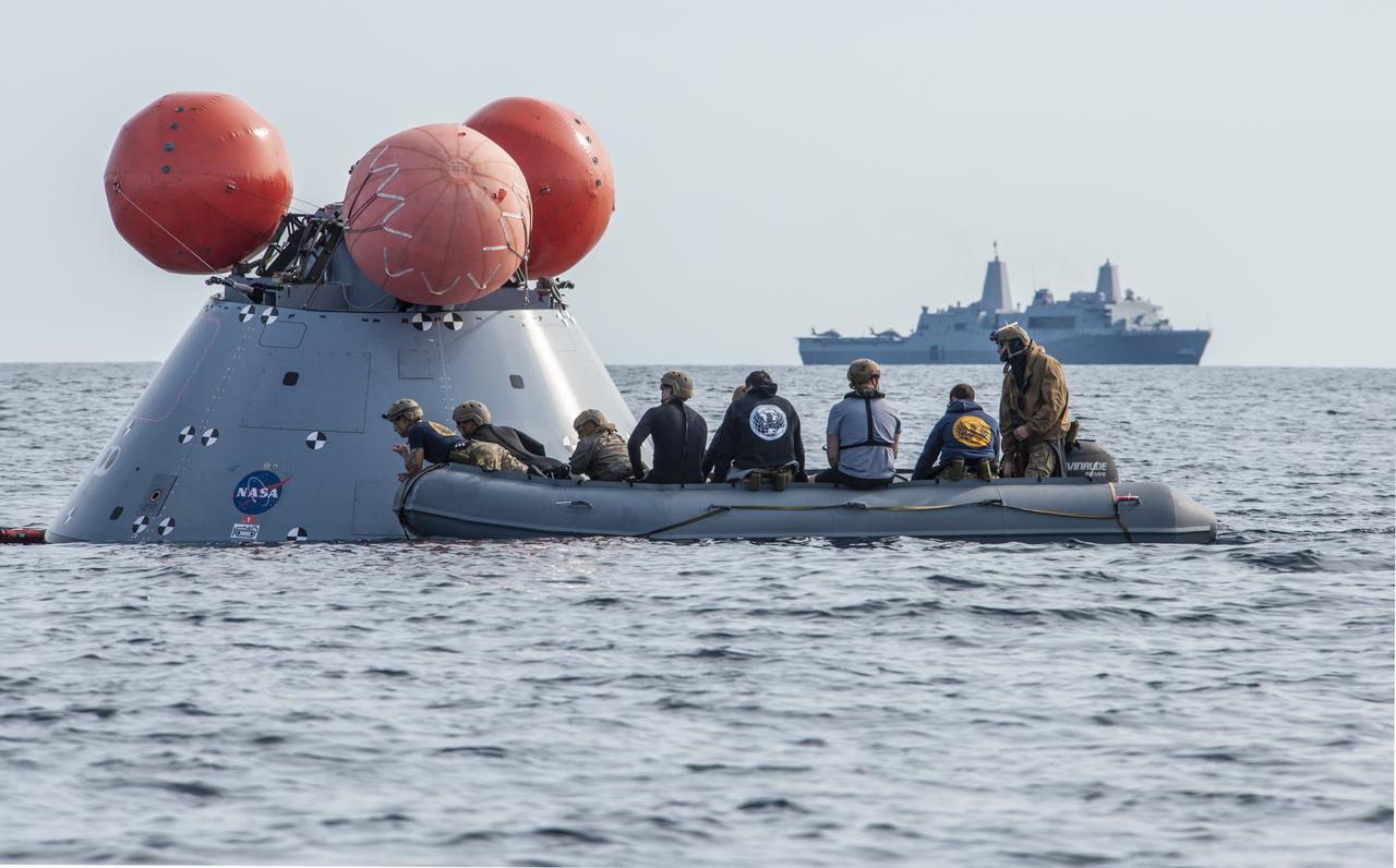 NASA's Landing and Recovery Team practices bringing a mock Orion capsule into the well deck of the USS Portland (LPD 27) ahead of the Artemis I Orion splashdown slated for Dec. 11.