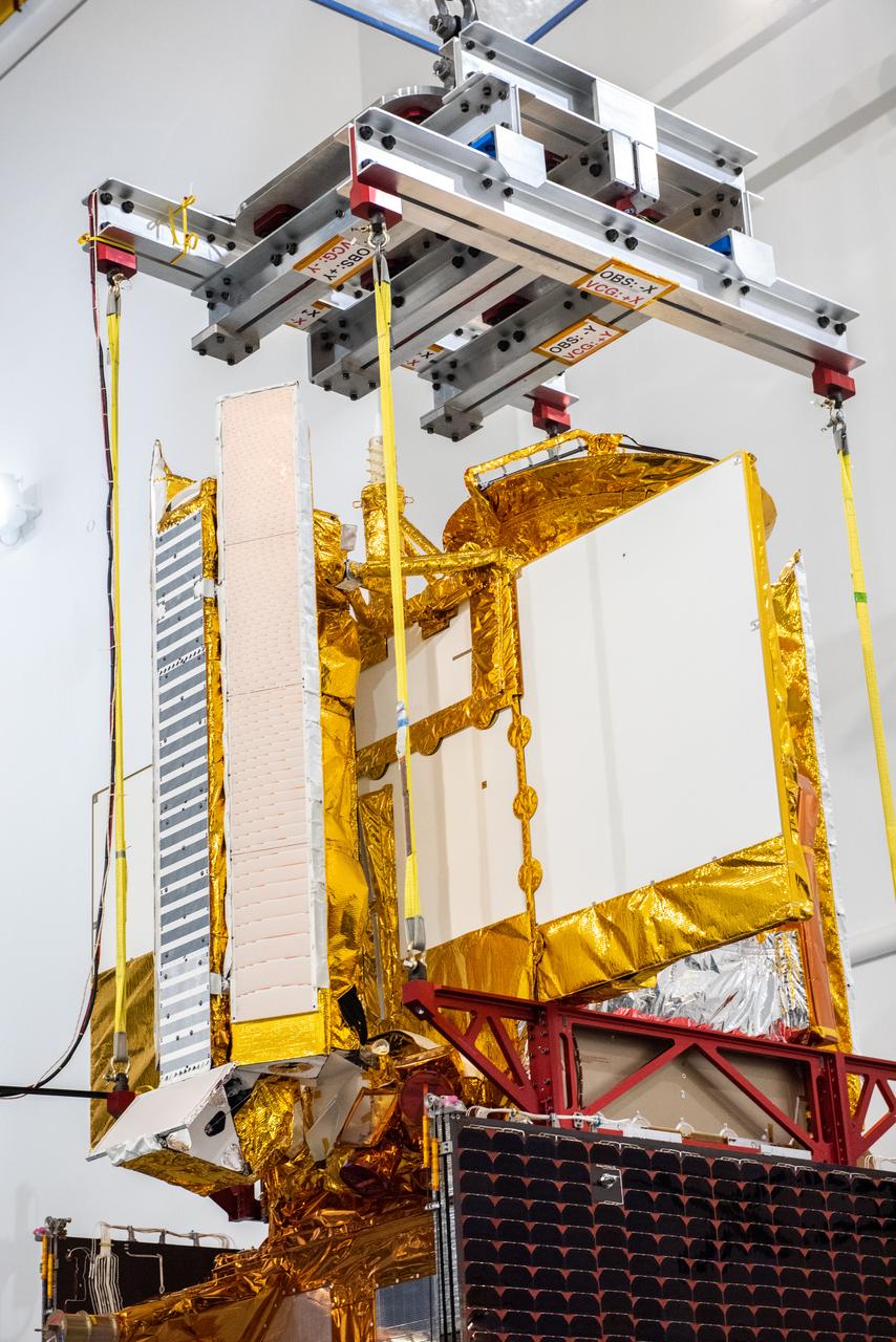 Inside the SpaceX facility at Vandenberg Space Force Base in California, a crane is used to lift the Surface Water and Ocean Topography (SWOT) satellite for mating to the payload adapter on Dec. 5, 2022. A collaboration between NASA and the French space agency Centre National d’Études Spatiales (CNES), with contributions from the Canadian Space Agency and the UK Space Agency, SWOT will be the first satellite to survey nearly all water on Earth’s surface. SWOT is scheduled to lift off aboard the SpaceX Falcon 9 rocket from Vandenberg on Dec. 15, 2022, at 3:46 a.m. PST. 
