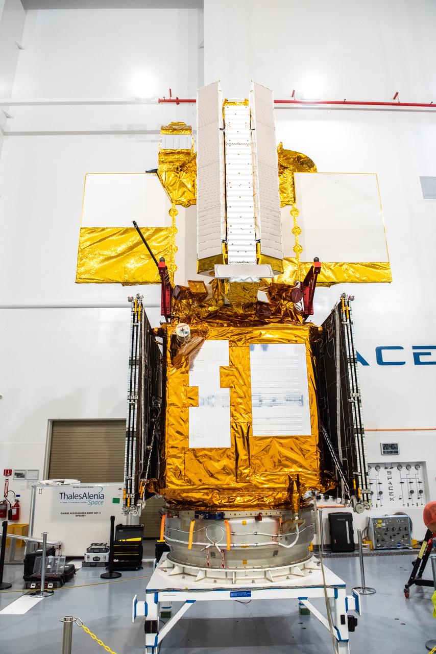 Inside the SpaceX facility at Vandenberg Space Force Base in California, a crane is used to lower the Surface Water and Ocean Topography (SWOT) satellite for mating to the payload adapter on Dec. 5, 2022. A collaboration between NASA and the French space agency Centre National d’Études Spatiales (CNES), with contributions from the Canadian Space Agency and the UK Space Agency, SWOT will be the first satellite to survey nearly all water on Earth’s surface. SWOT is scheduled to lift off aboard the SpaceX Falcon 9 rocket from Vandenberg on Dec. 15, 2022, at 3:46 a.m. PST.